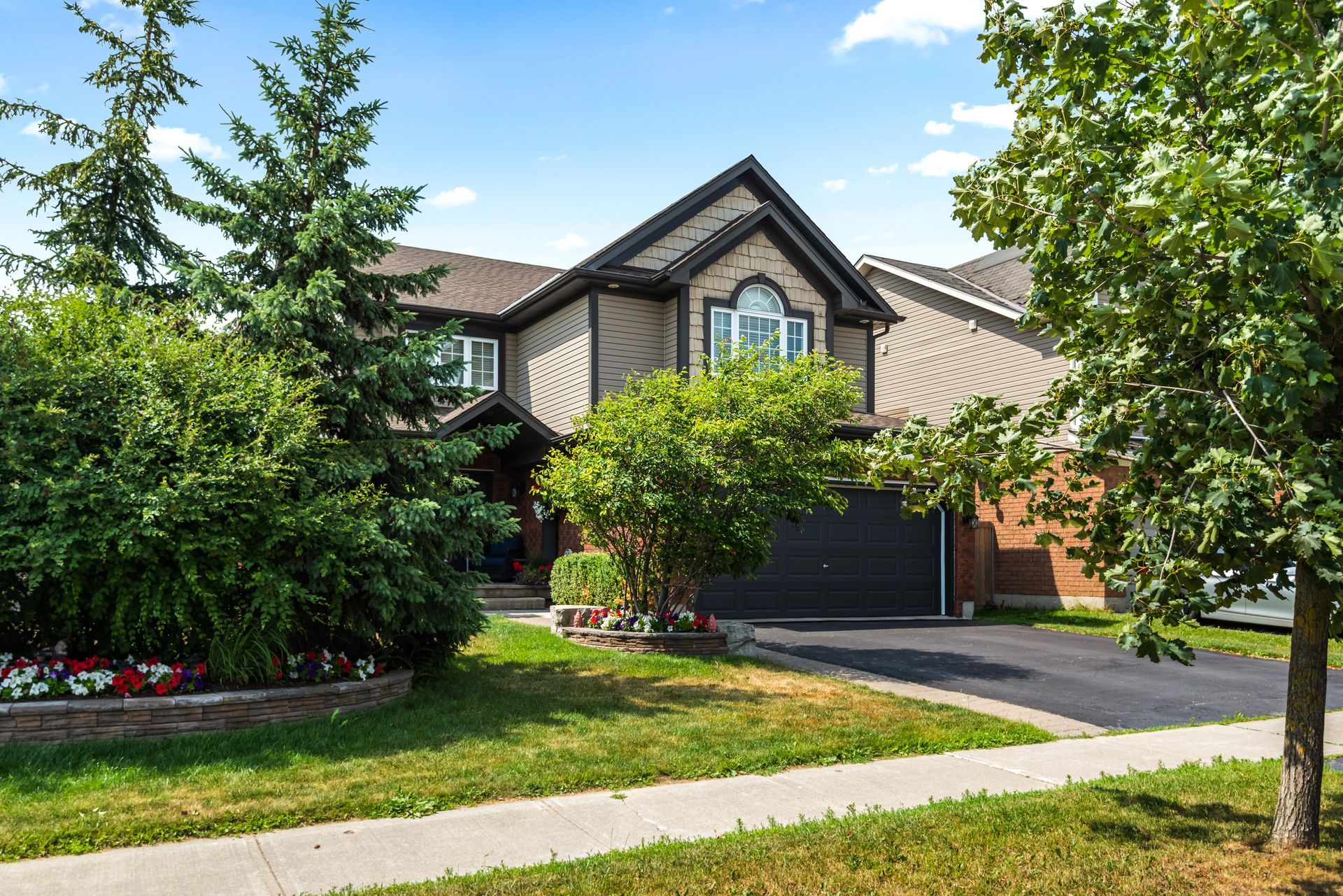 A large house with a lot of trees in front of it.