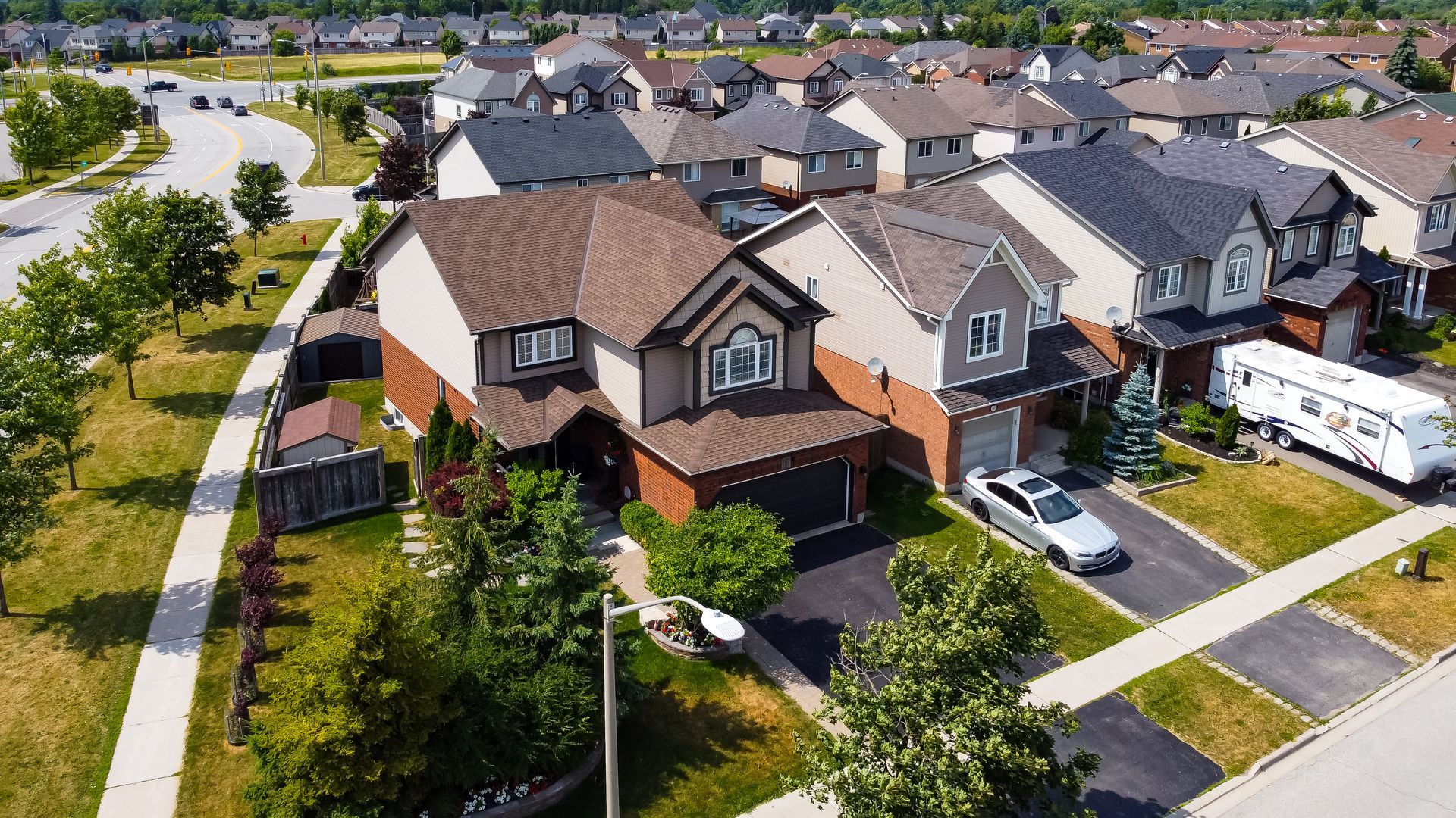 An aerial view of a residential area with lots of houses and trees.