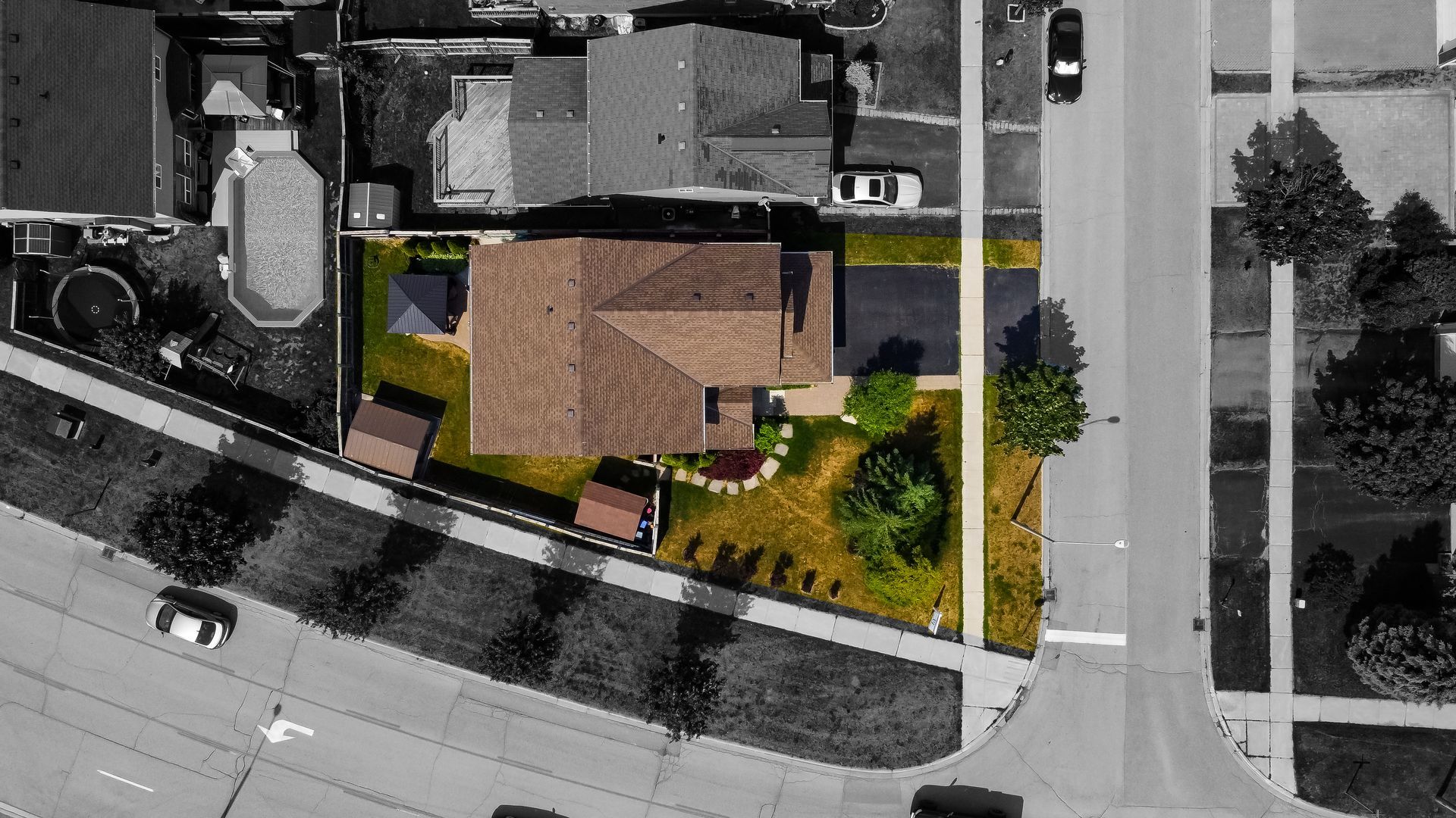 An aerial view of a house in a residential area