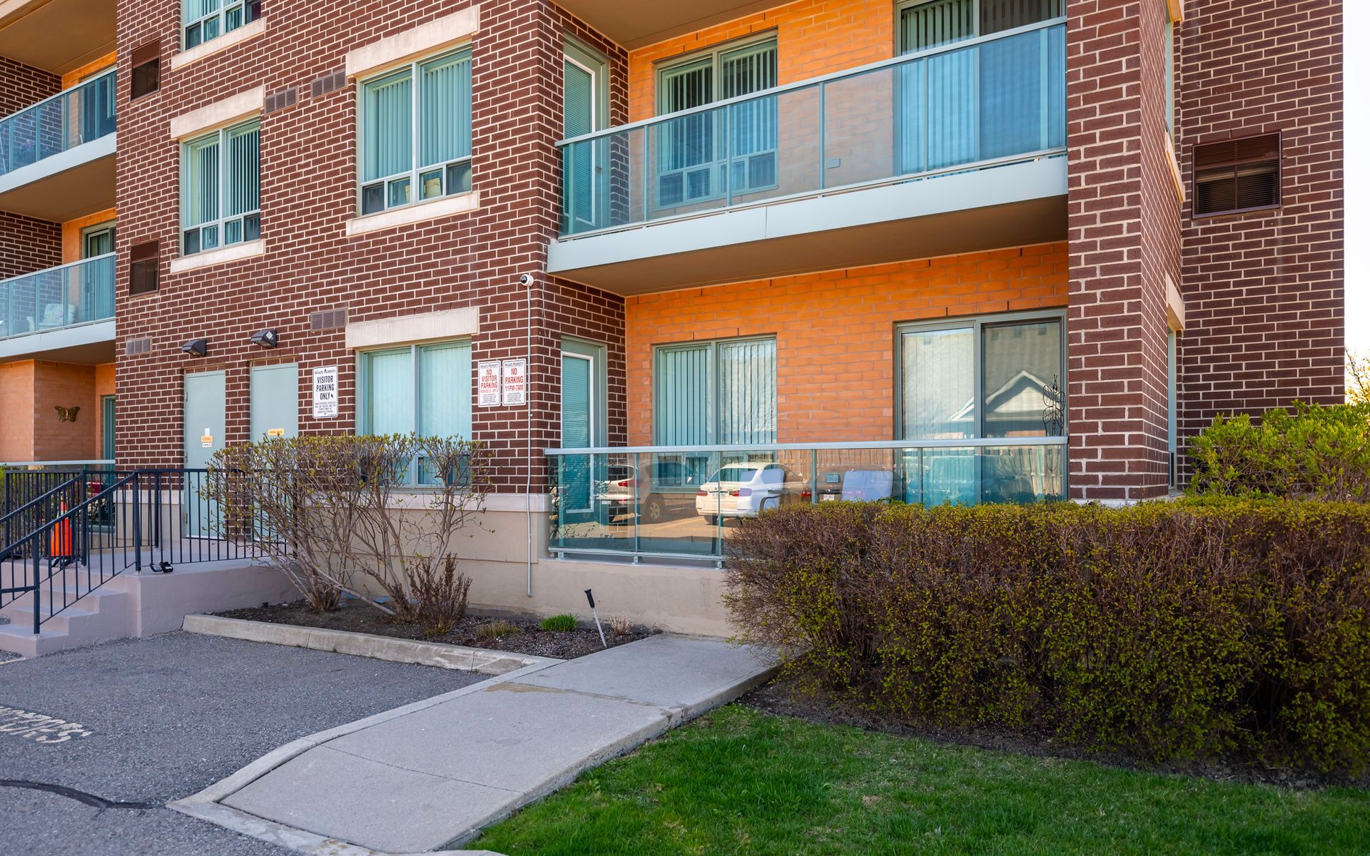 A large brick building with a lot of windows and balconies.
