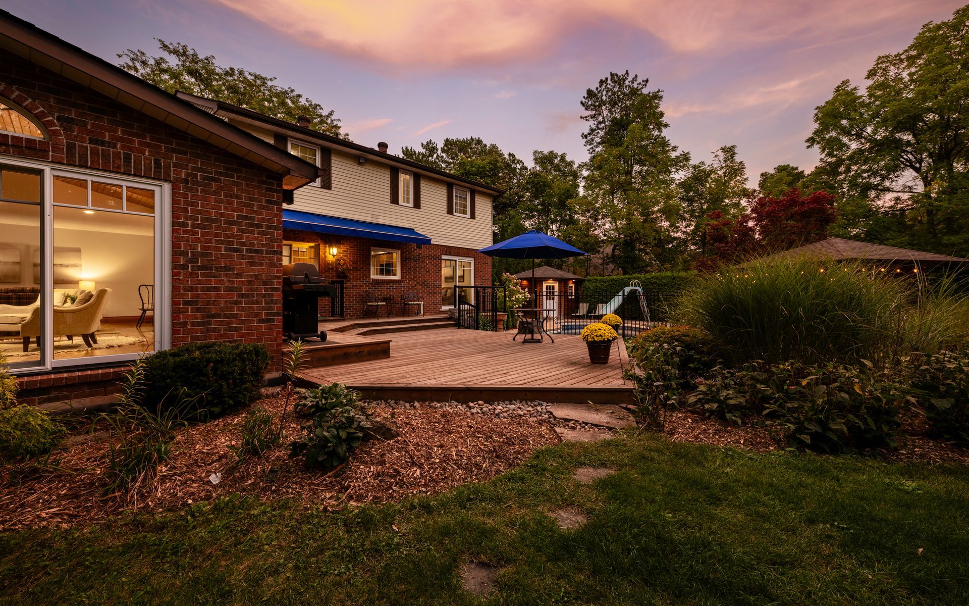 A brick house with a large patio in front of it
