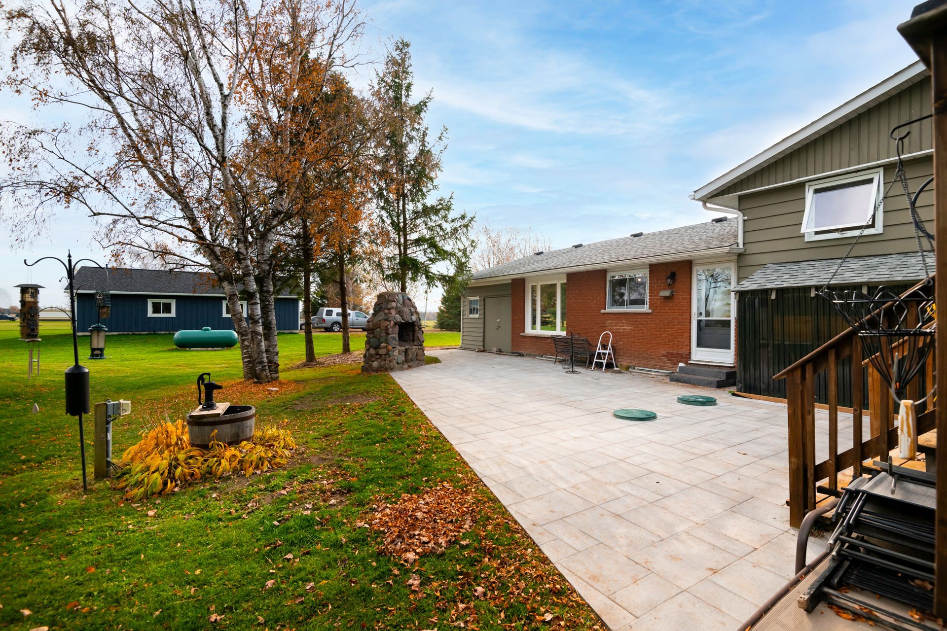 A house with a patio and stairs in front of it