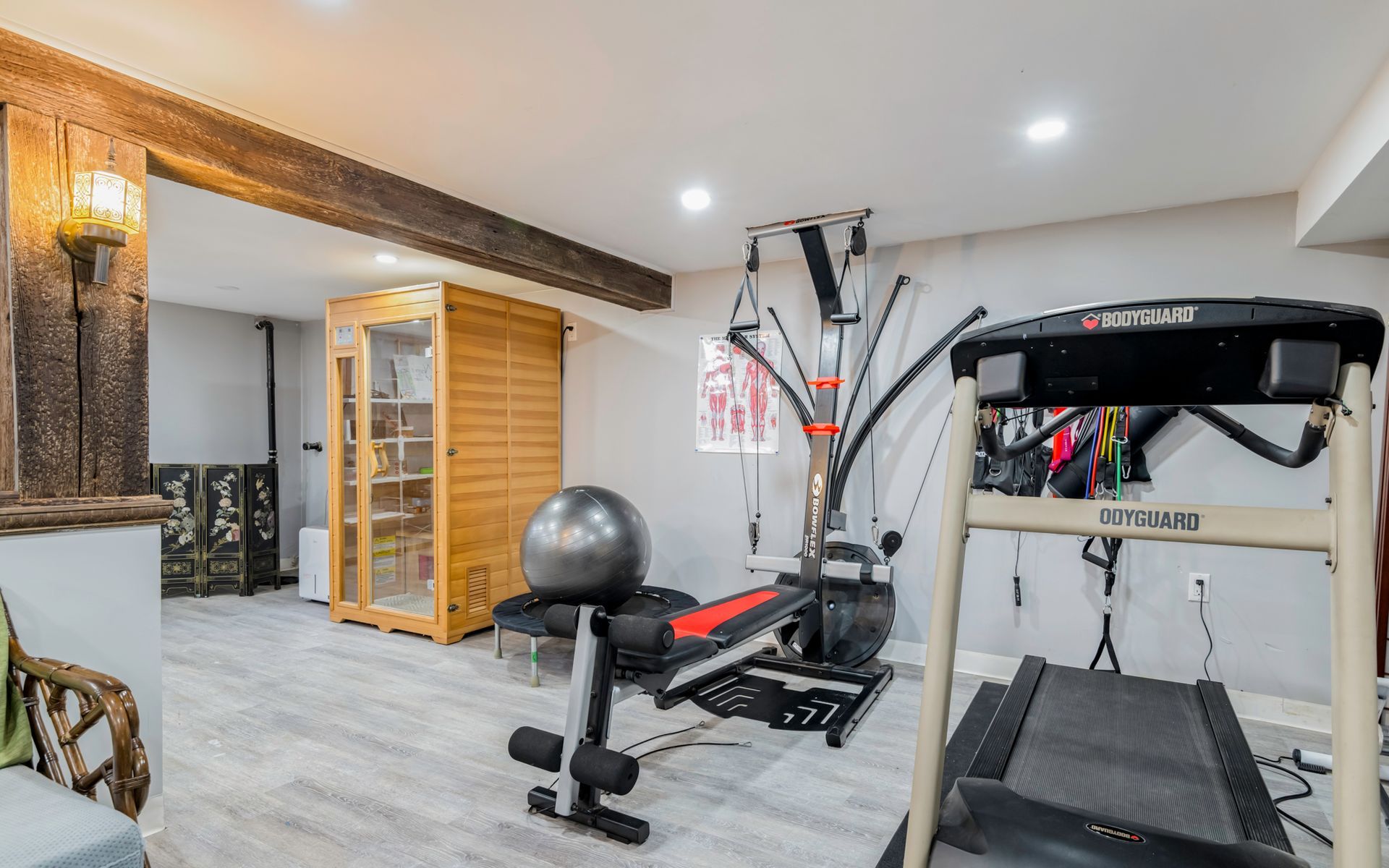 There is a treadmill in the middle of the room.