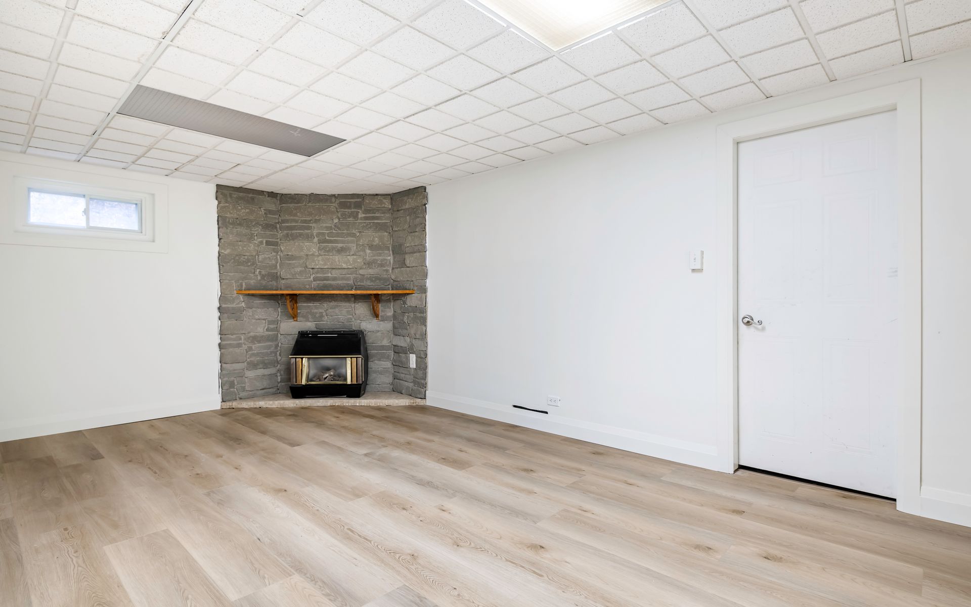 There is a fireplace in the corner of the room.