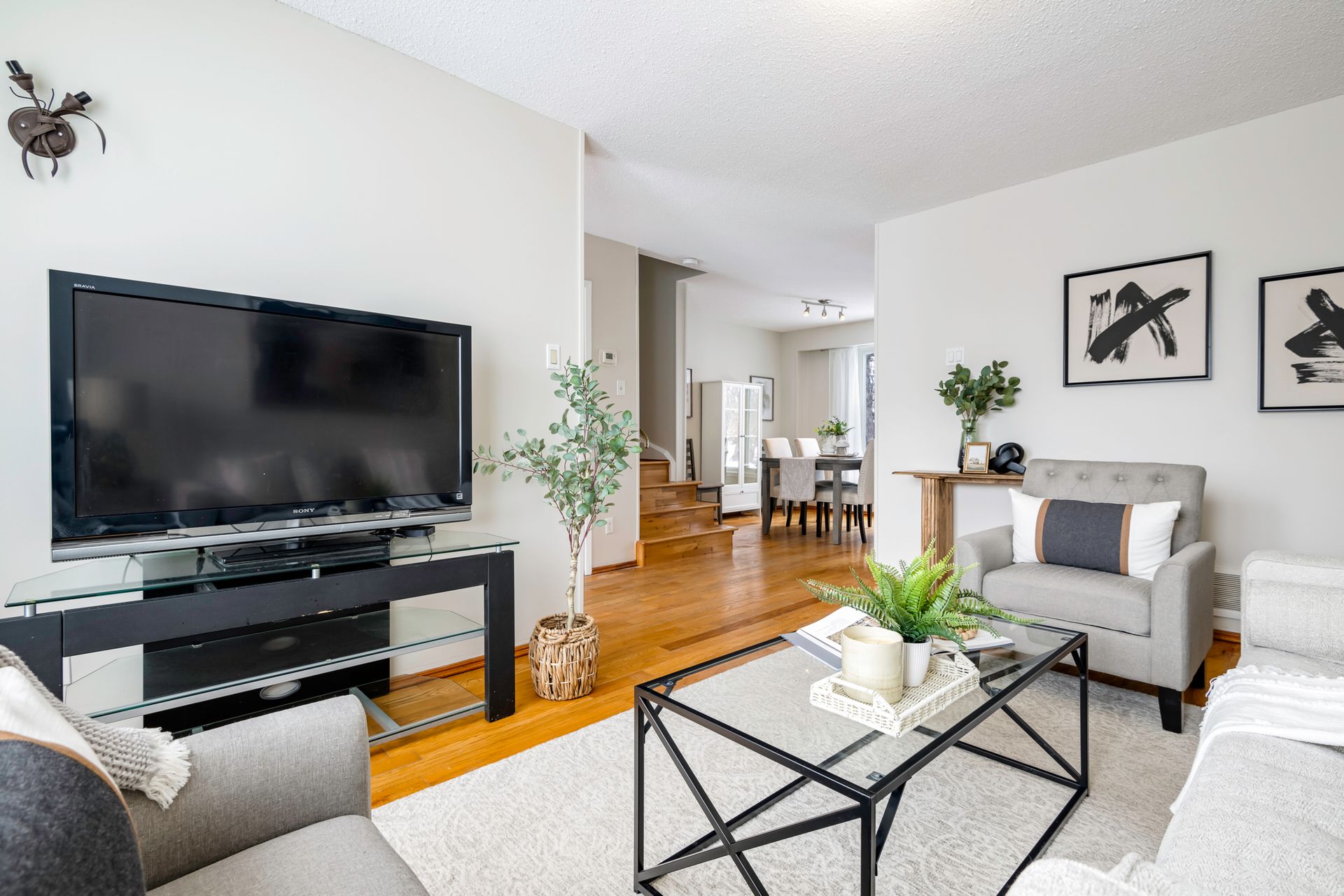 A living room filled with furniture and a flat screen tv.