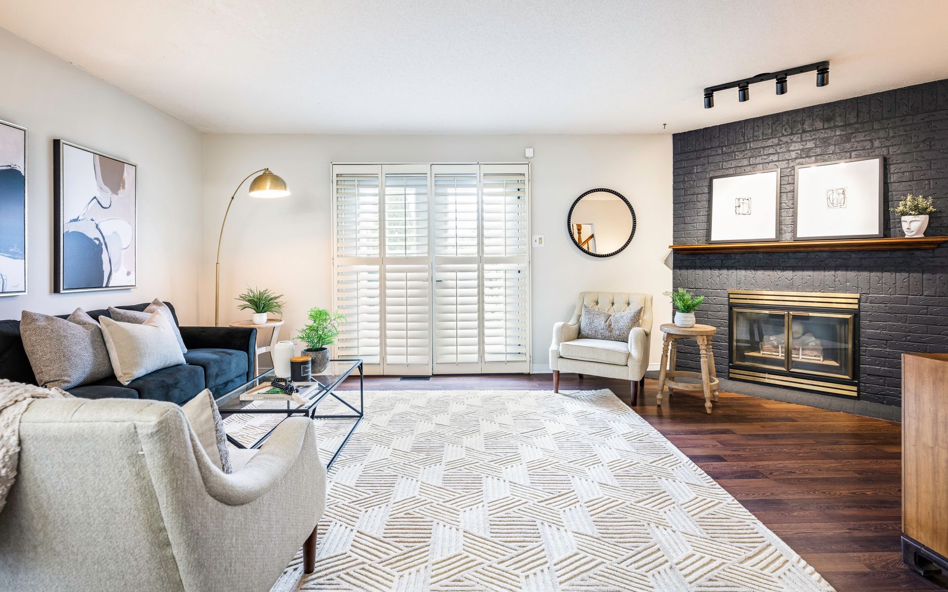 A living room filled with furniture and a fireplace.