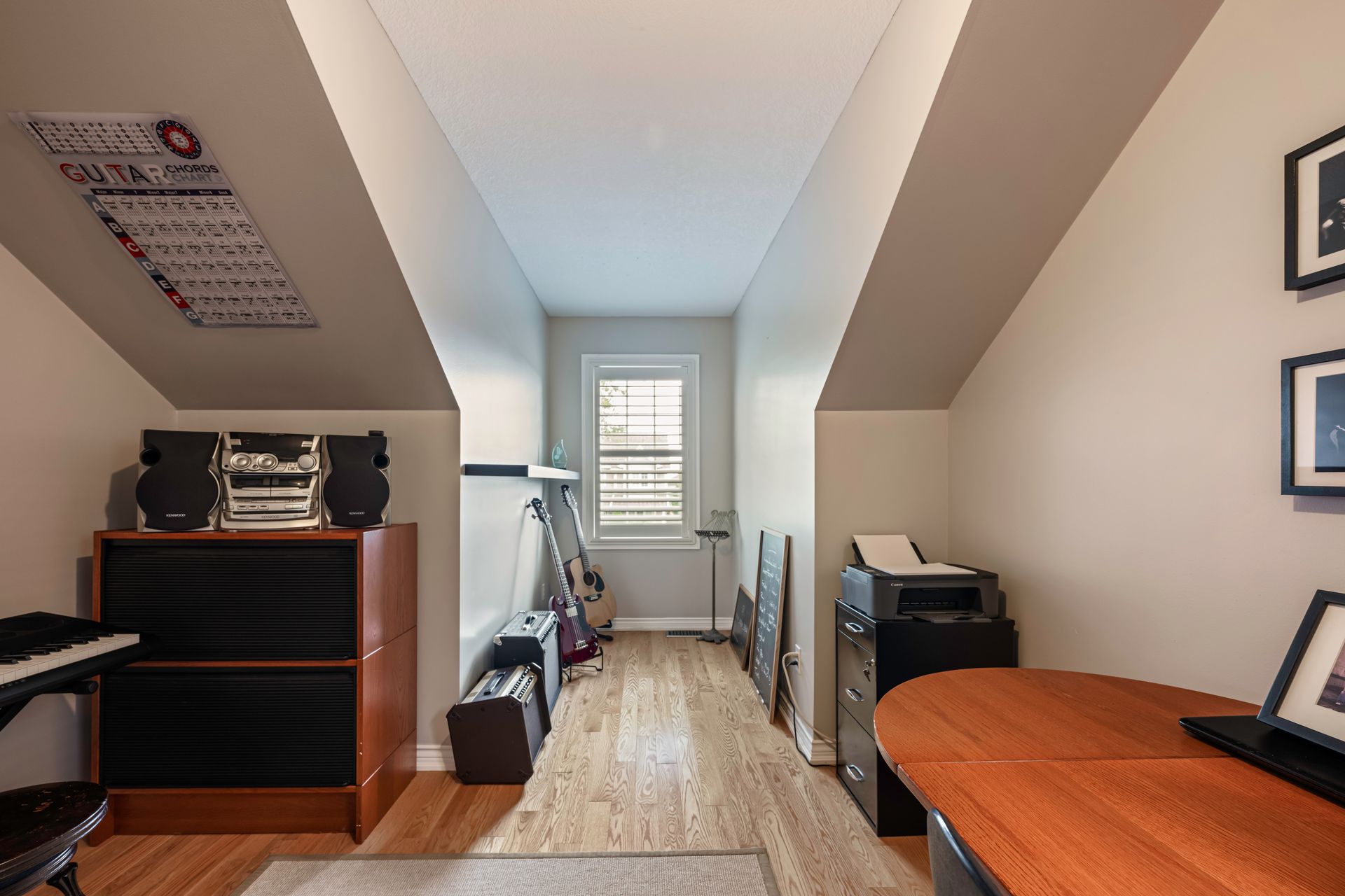 A room with a piano and a printer in it