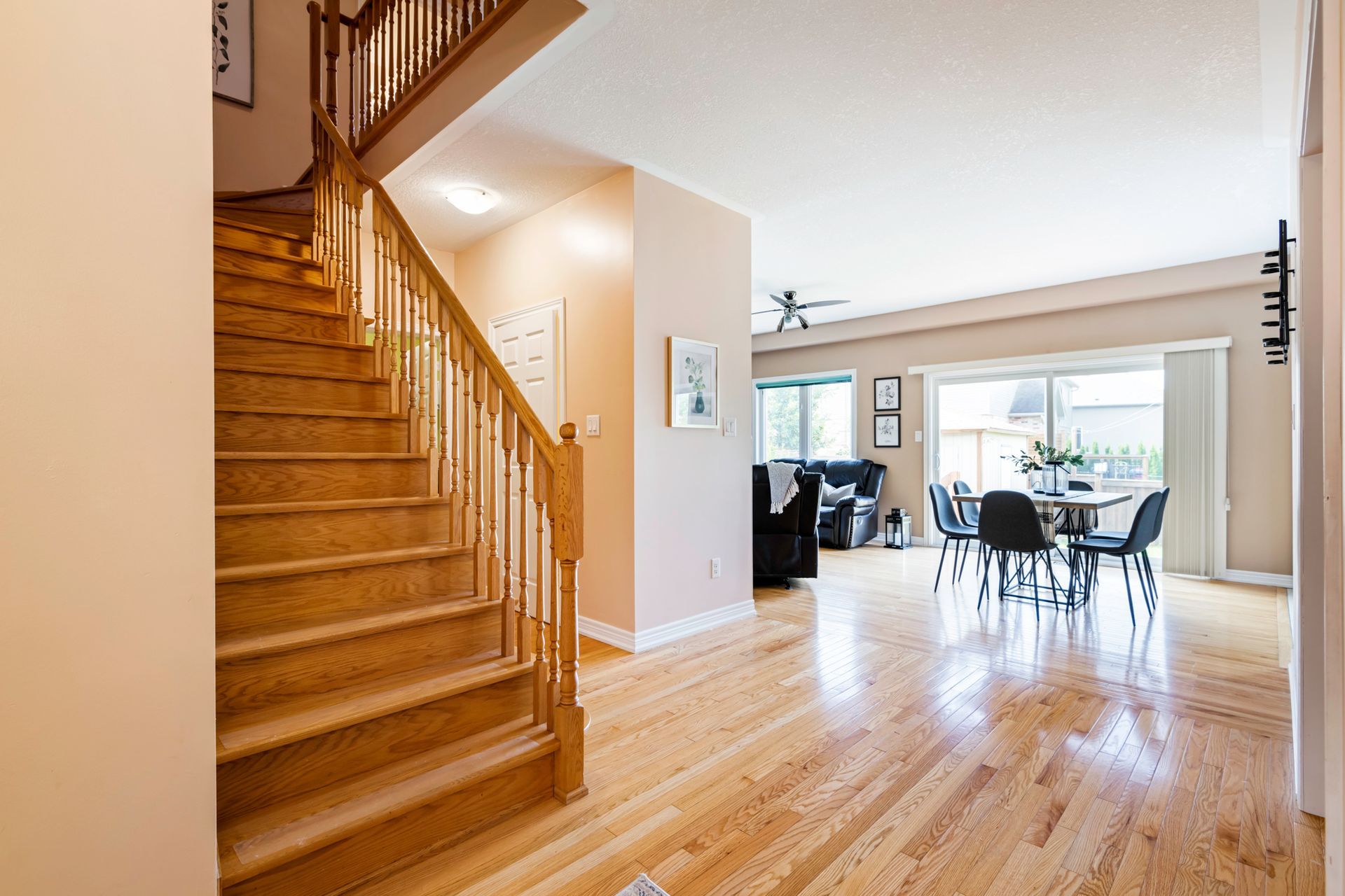 A wooden staircase leading up to the second floor of a house.