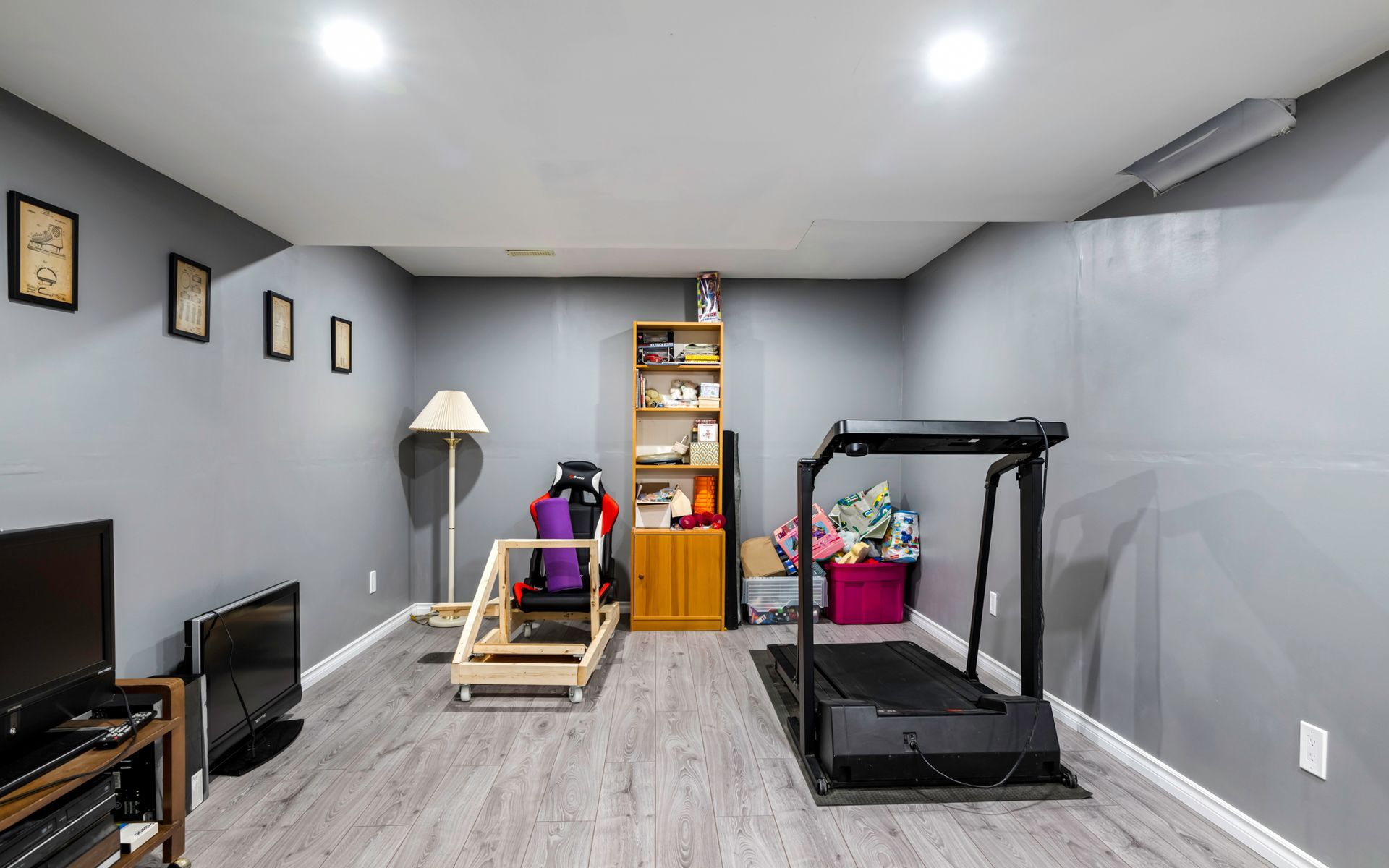 There is a treadmill in the middle of the room.