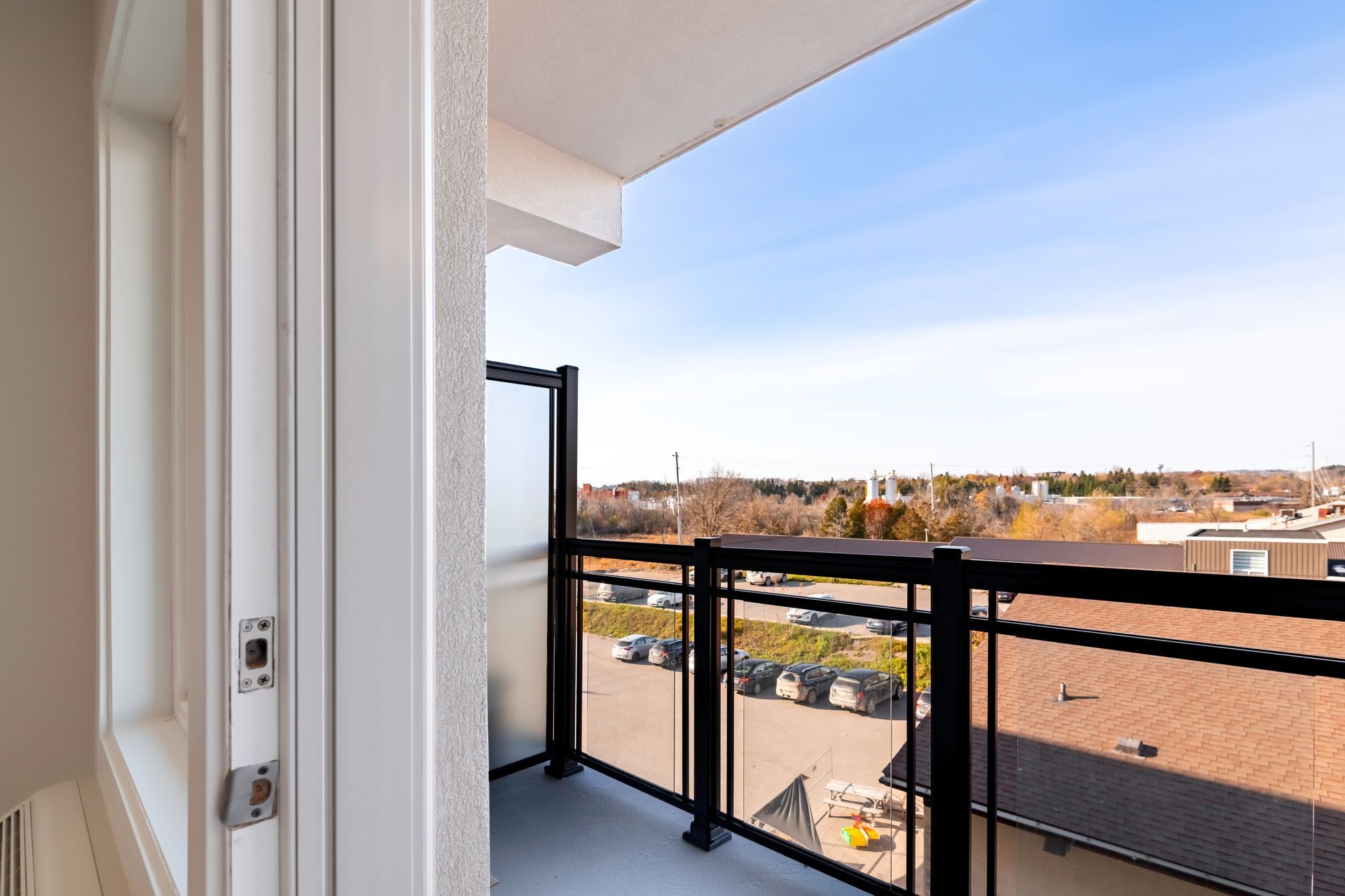 A balcony with a view of a city and a building.