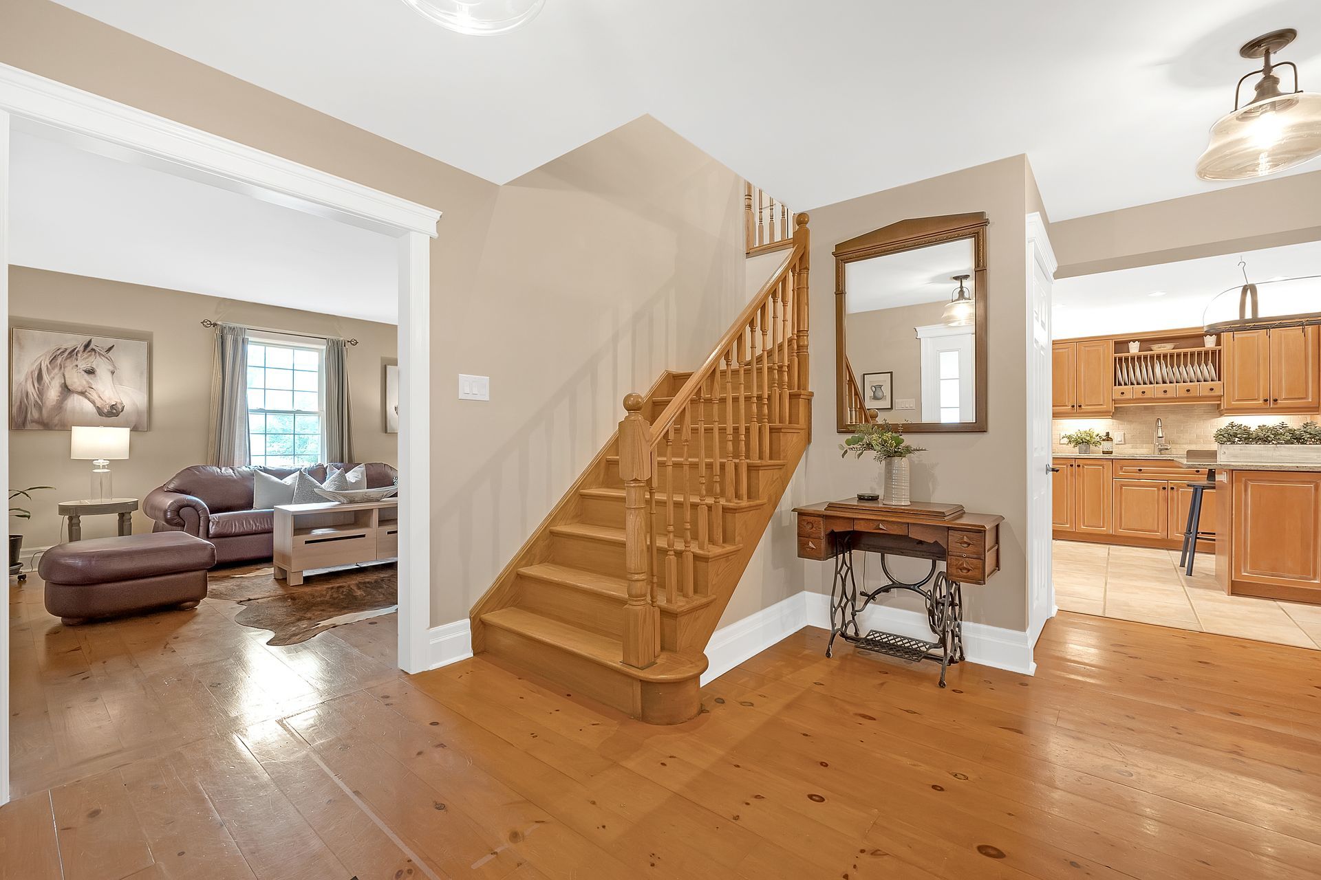 A wooden staircase leading up to the second floor of a house.