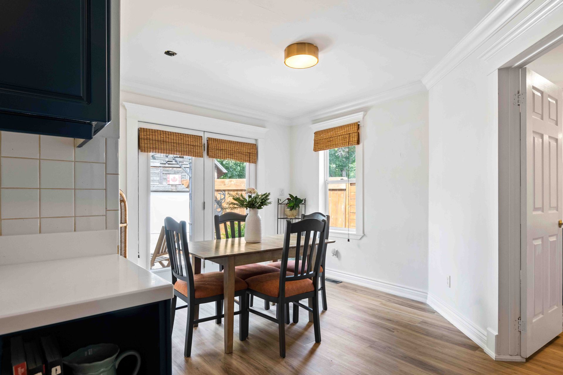 A dining room with a table and chairs in a house.