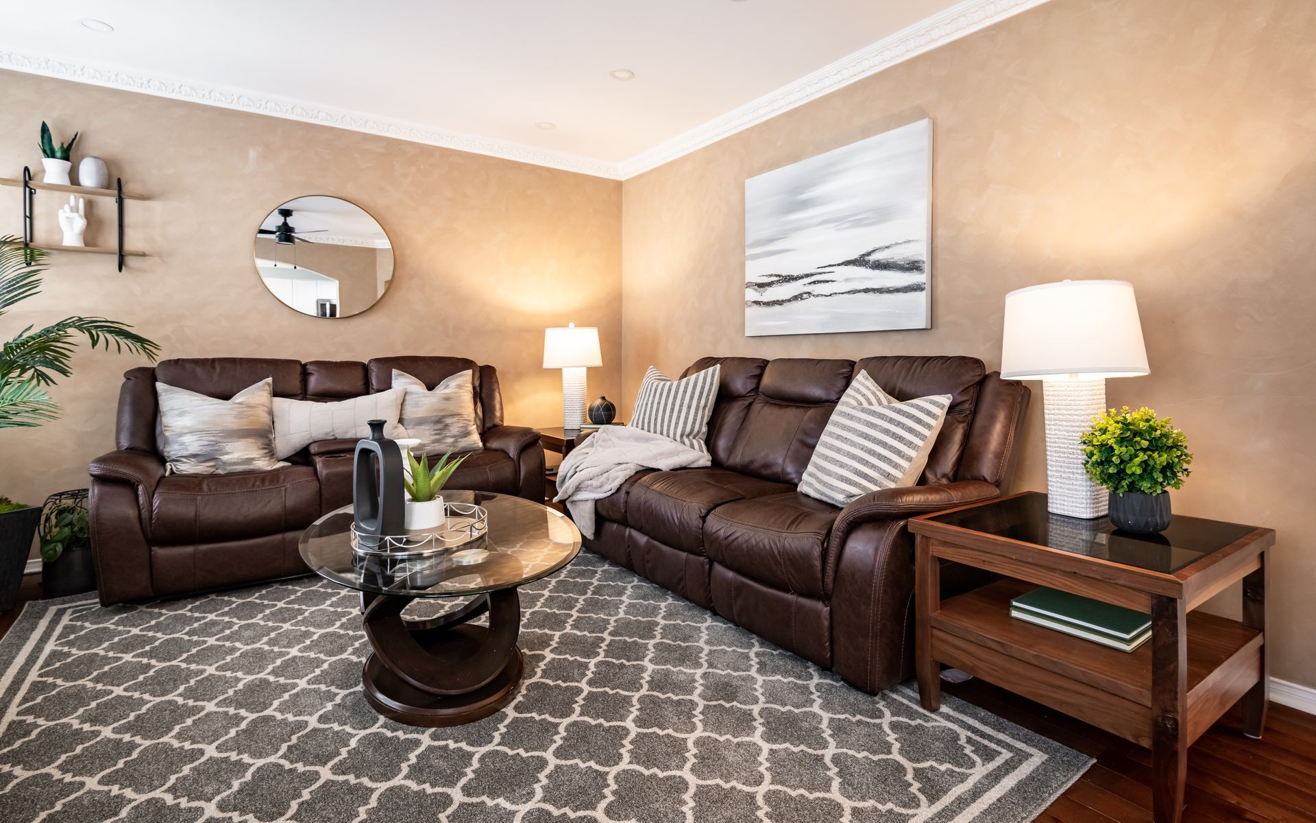 A living room with a brown couch and a coffee table.