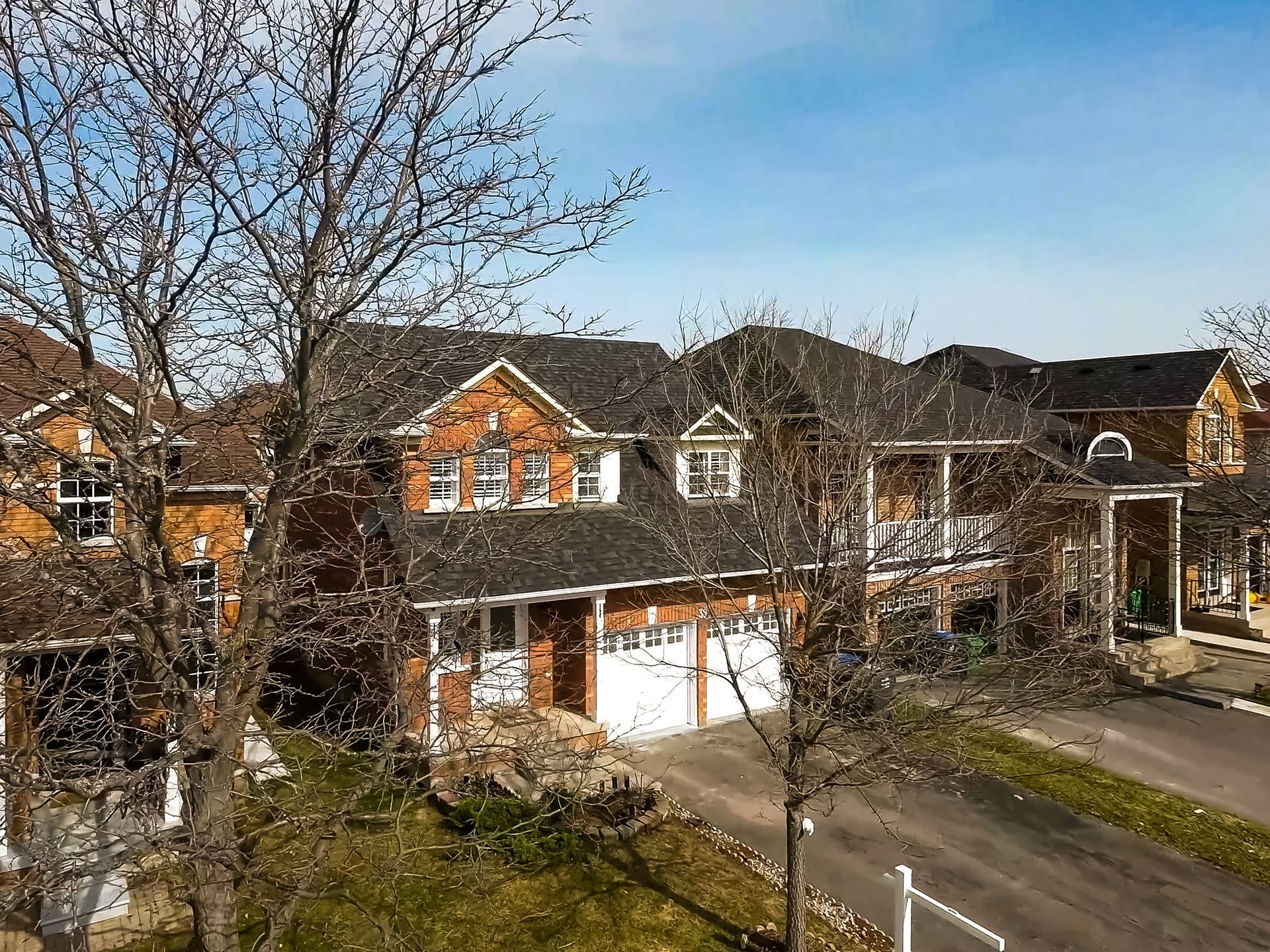 An aerial view of a row of houses in a residential area.