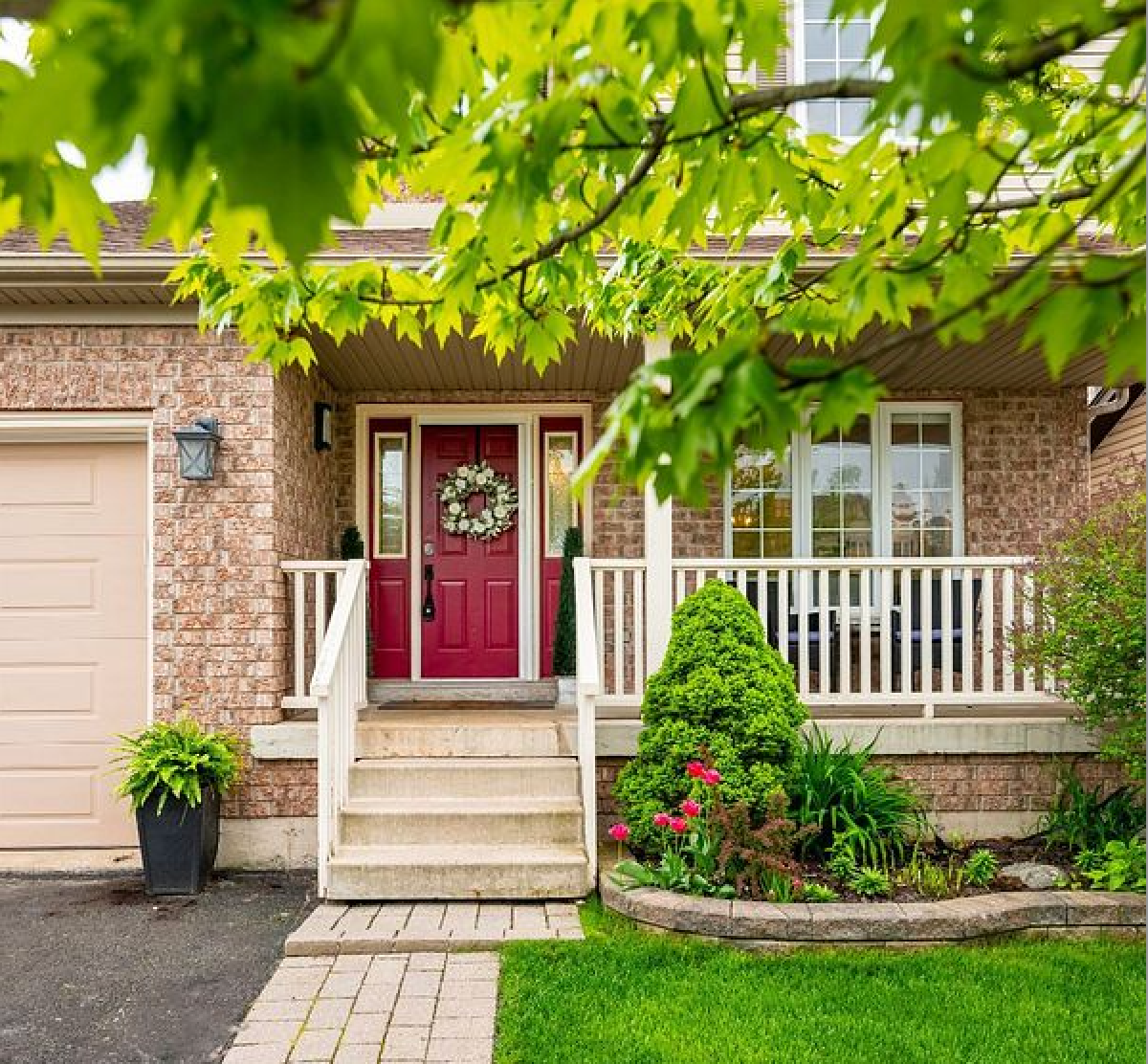A large brick house with a garage and a driveway
