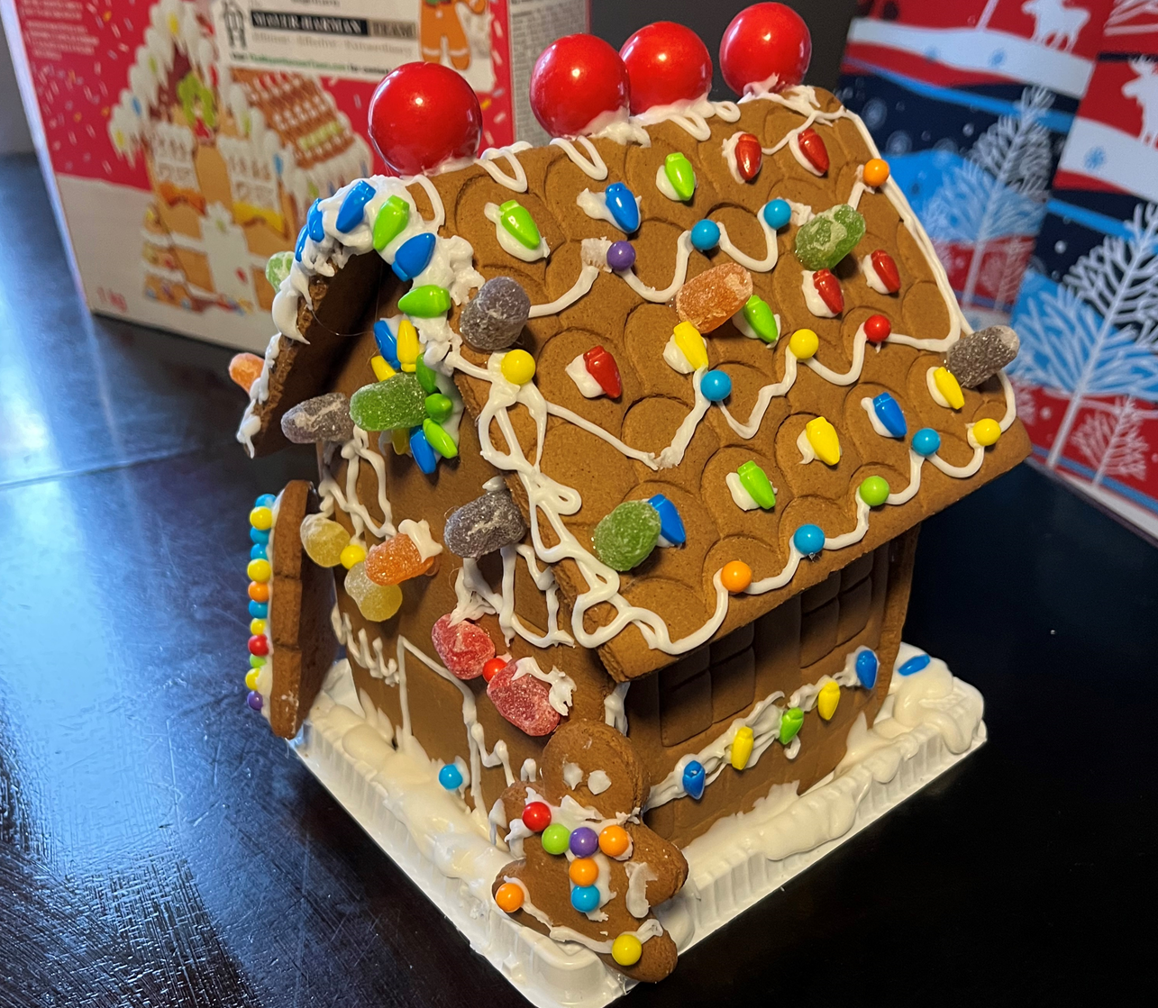 A gingerbread house decorated with candy and icing