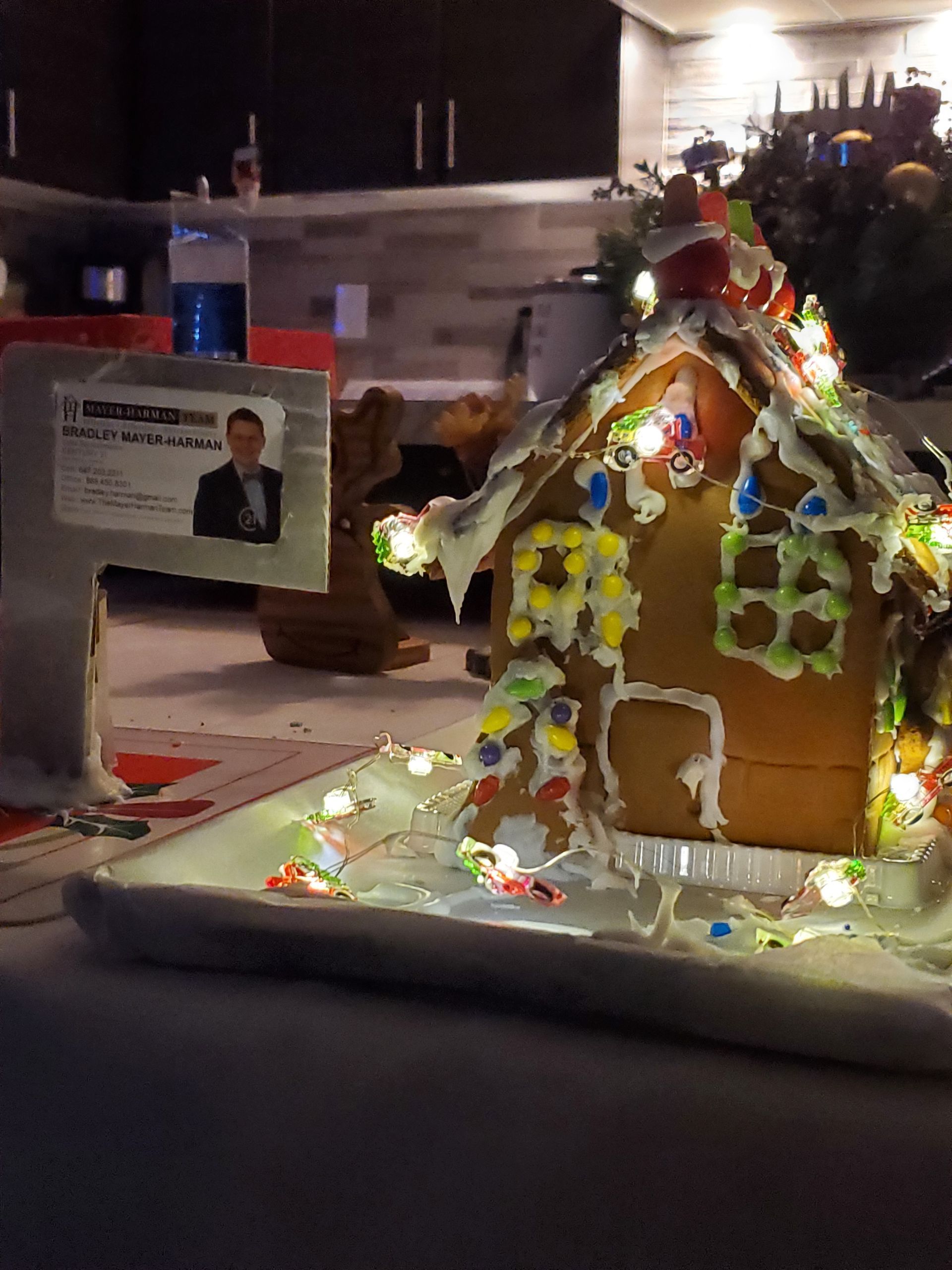A gingerbread house with a picture of a man on it