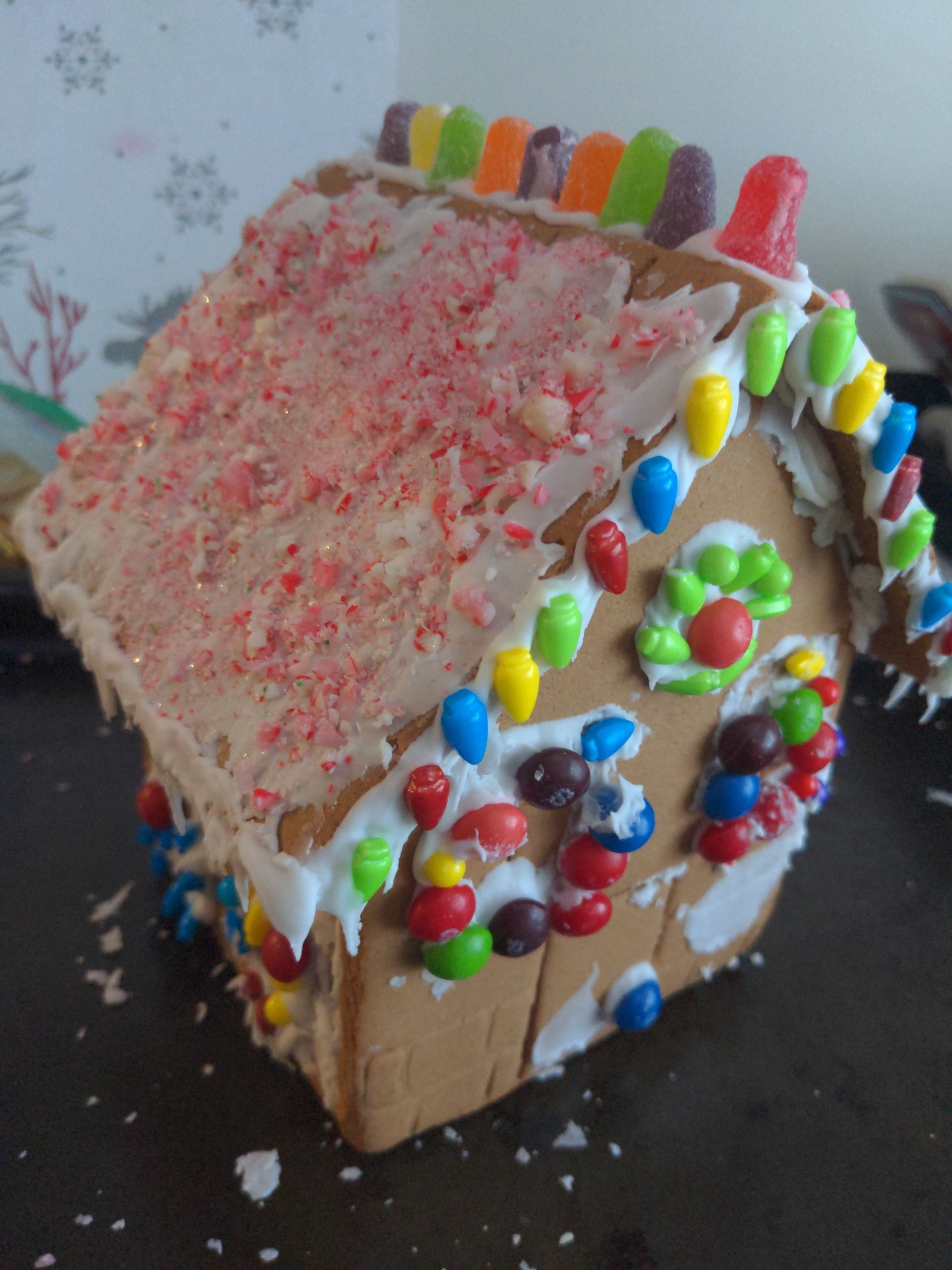 A gingerbread house decorated with candy and frosting