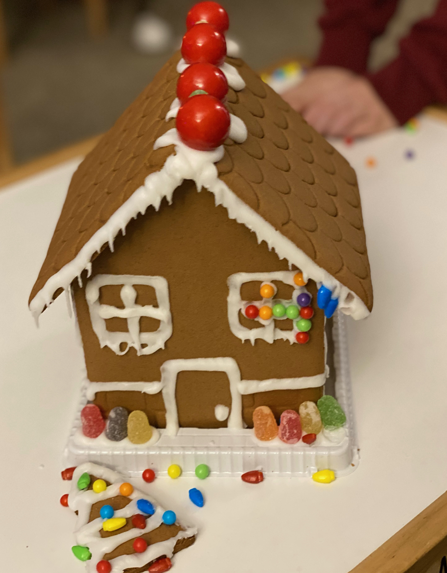 A gingerbread house sitting on top of a white table