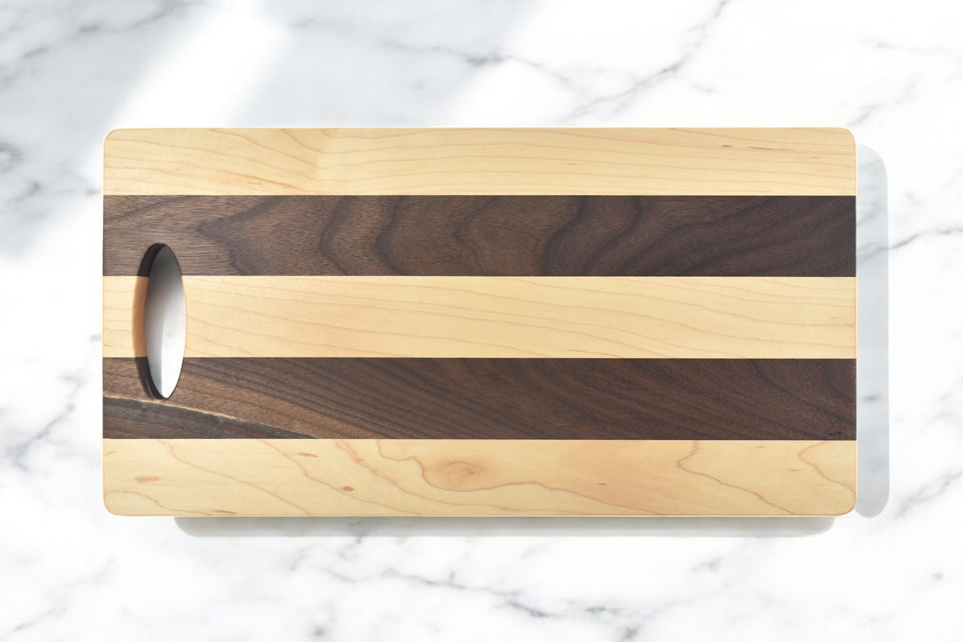 A wooden cutting board with a hole in the middle