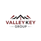 Logo with mountain peaks and a key, "Valley Key Group" text in burgundy.