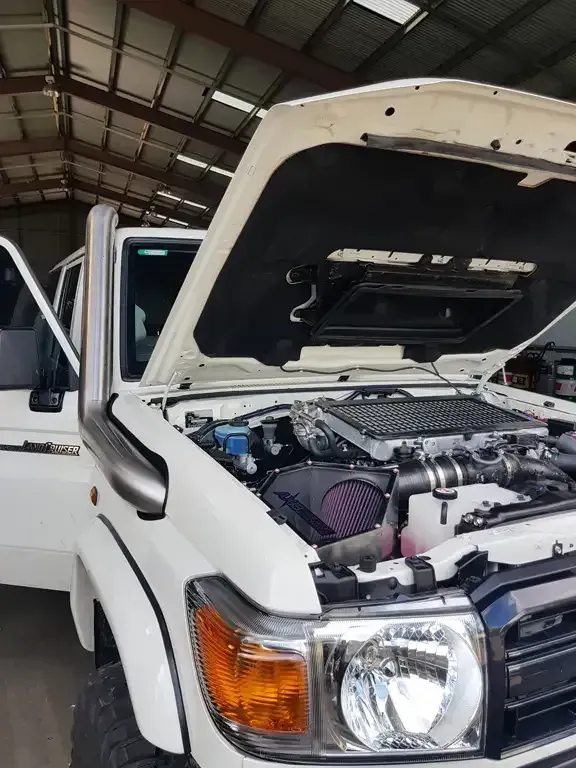 White SUV With Open Hood, Engine Visible, Snorkel, in a Garage — HOLESHOT Diesel In Gympie, QLD