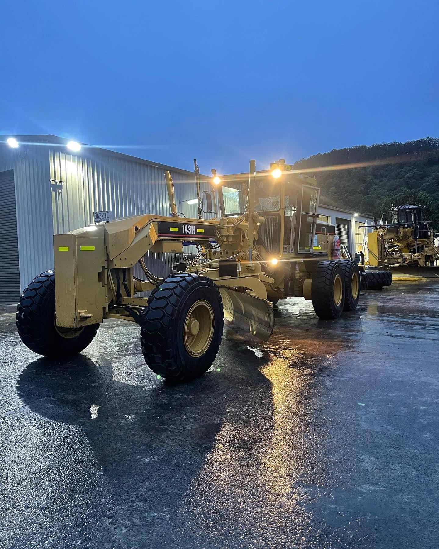 A Large, Tan Construction Grader Parked — HOLESHOT Diesel In Emerald, QLD