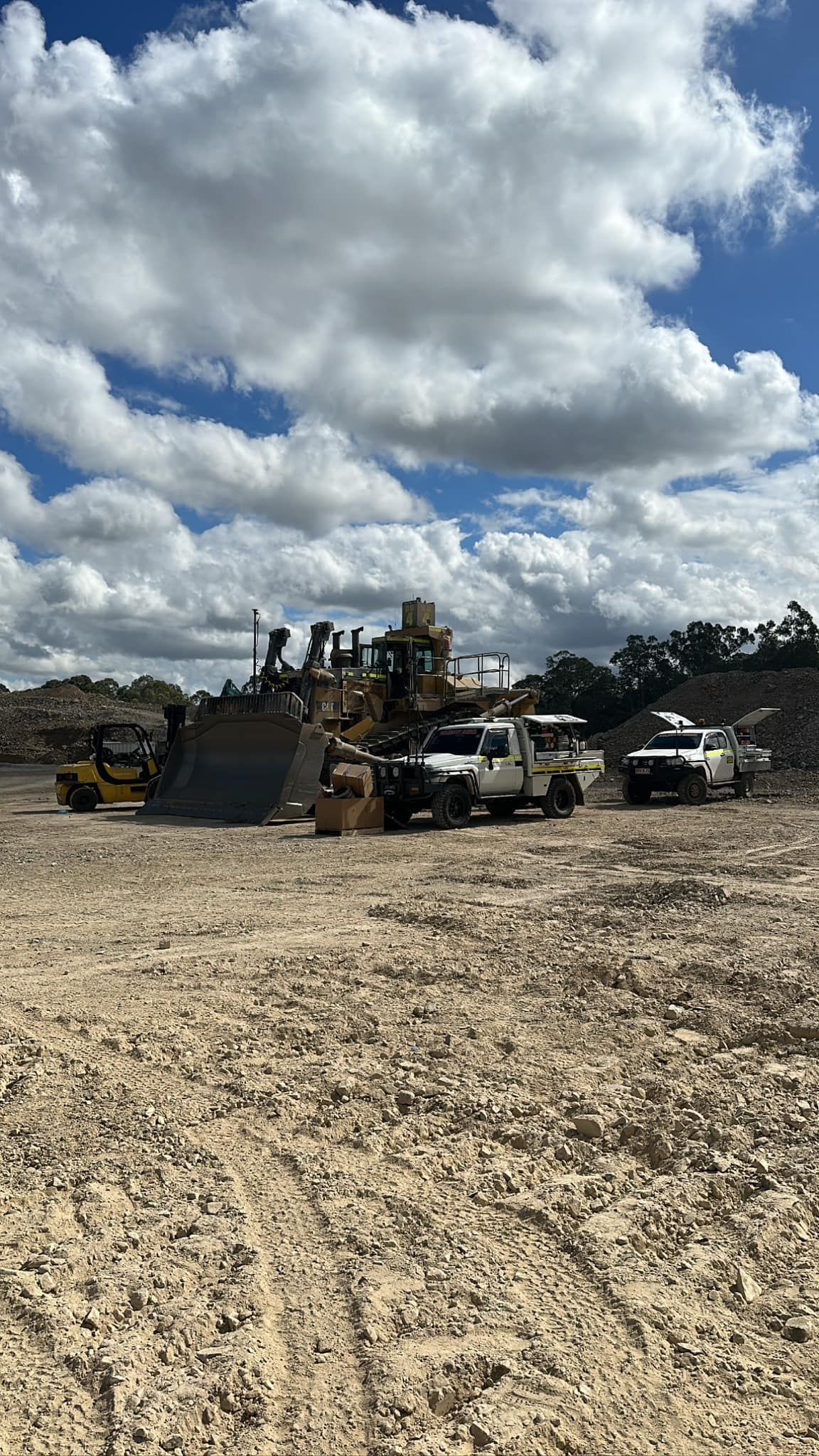 Construction Site With Heavy Machinery and Trucks Under a Cloudy Sky — HOLESHOT Diesel In Gympie, QLD