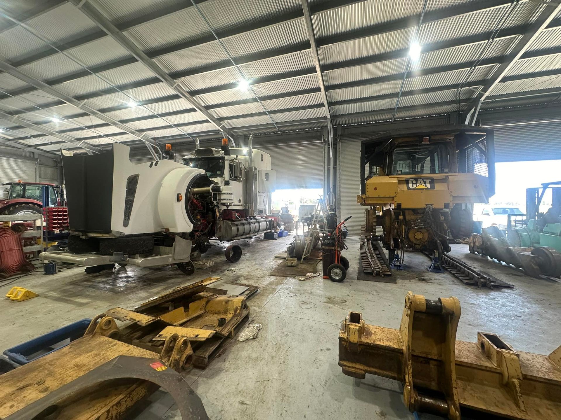 Workshop With Heavy Machinery Undergoing Repairs — HOLESHOT Diesel In Chinchilla, QLD