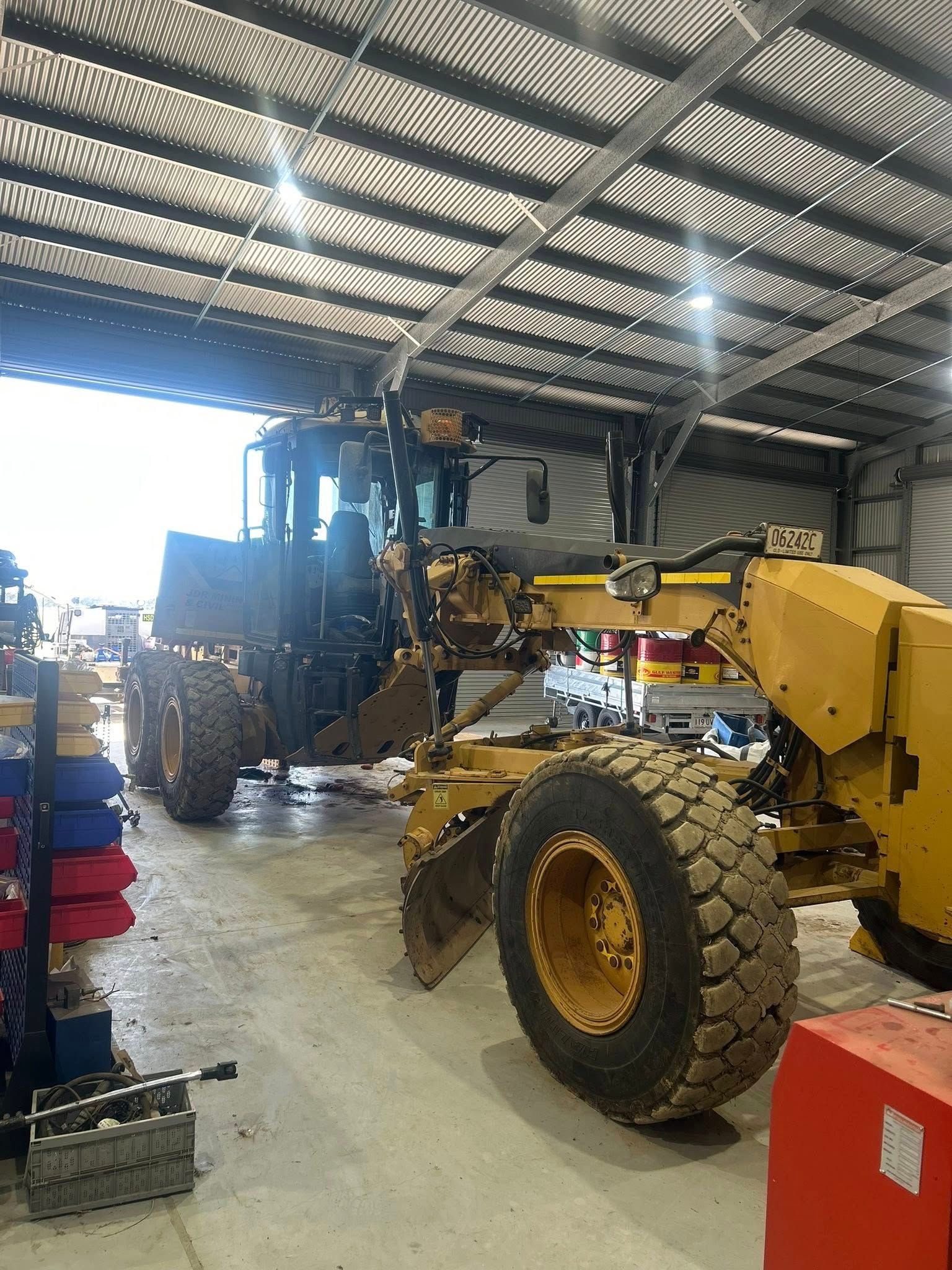 Yellow Grader Inside a Shop — HOLESHOT Diesel In Gympie, QLD