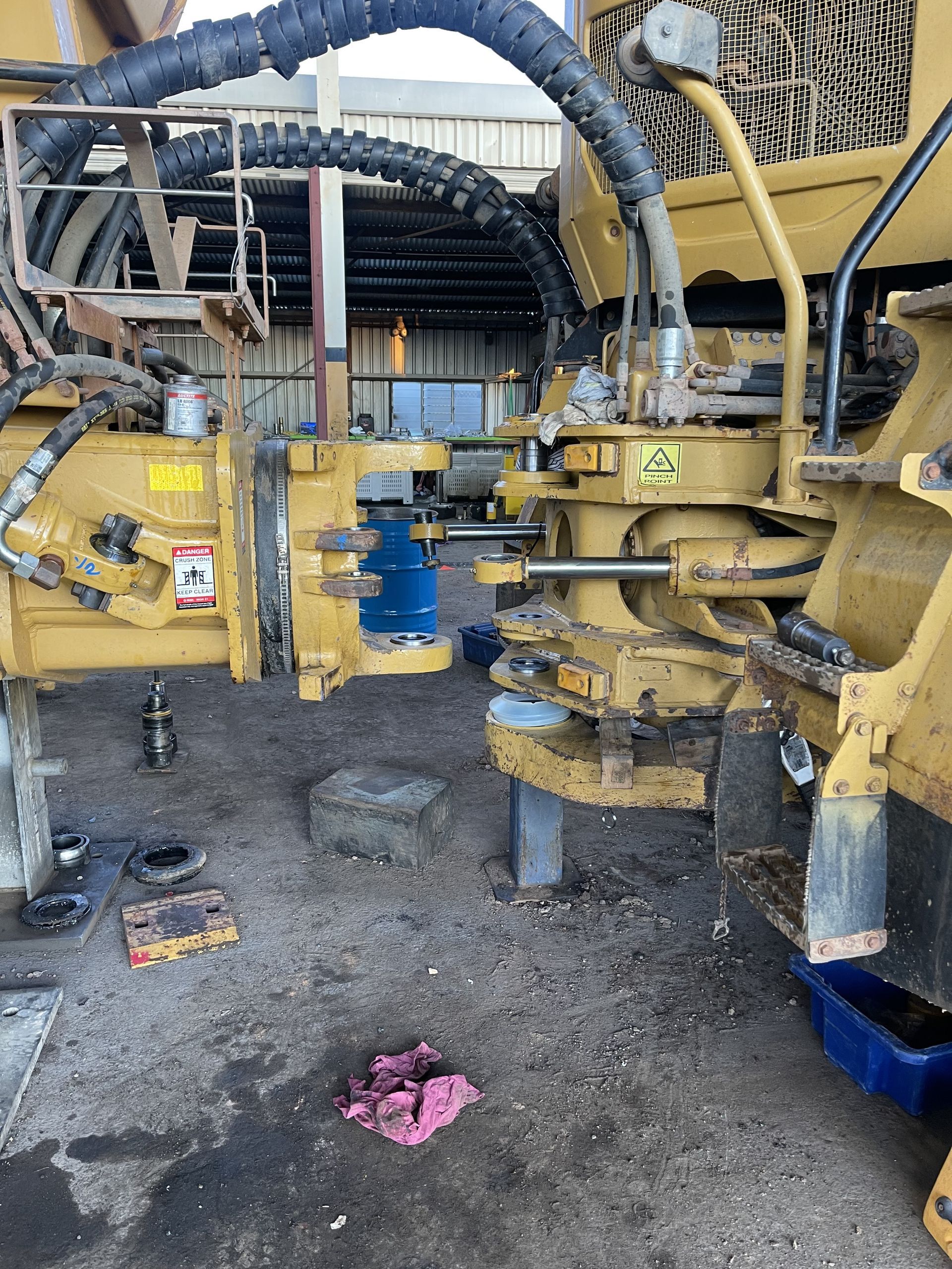 Yellow Heavy Machinery in a Workshop, Possibly Under Repair — HOLESHOT Diesel In Gympie, QLD