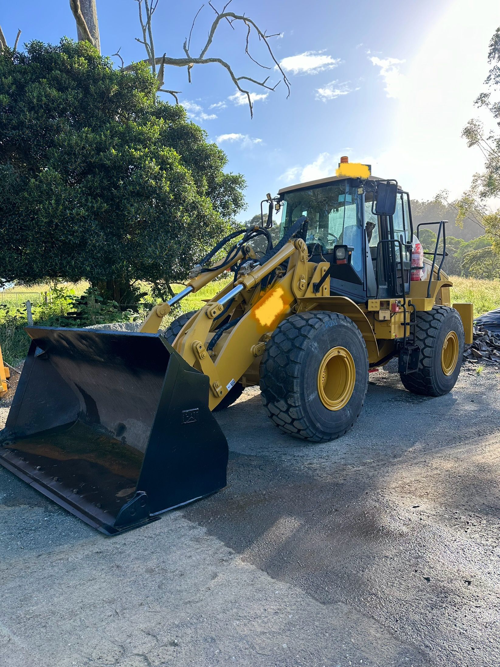 Yellow Front-end Loader Parked Outdoors With Black Bucket — HOLESHOT Diesel In Miles, QLD