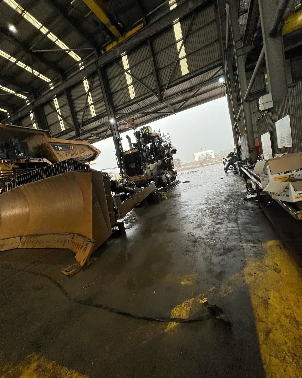 A Bulldozer and Other Machinery Inside a Warehouse — HOLESHOT Diesel In Toowoomba, QLD