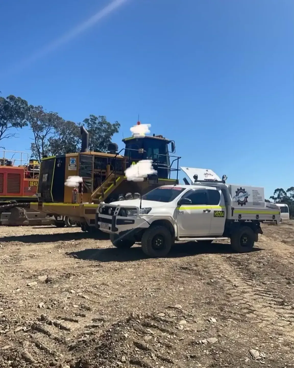 White Truck and Yellow Heavy Machinery — HOLESHOT Diesel In Gympie, QLD