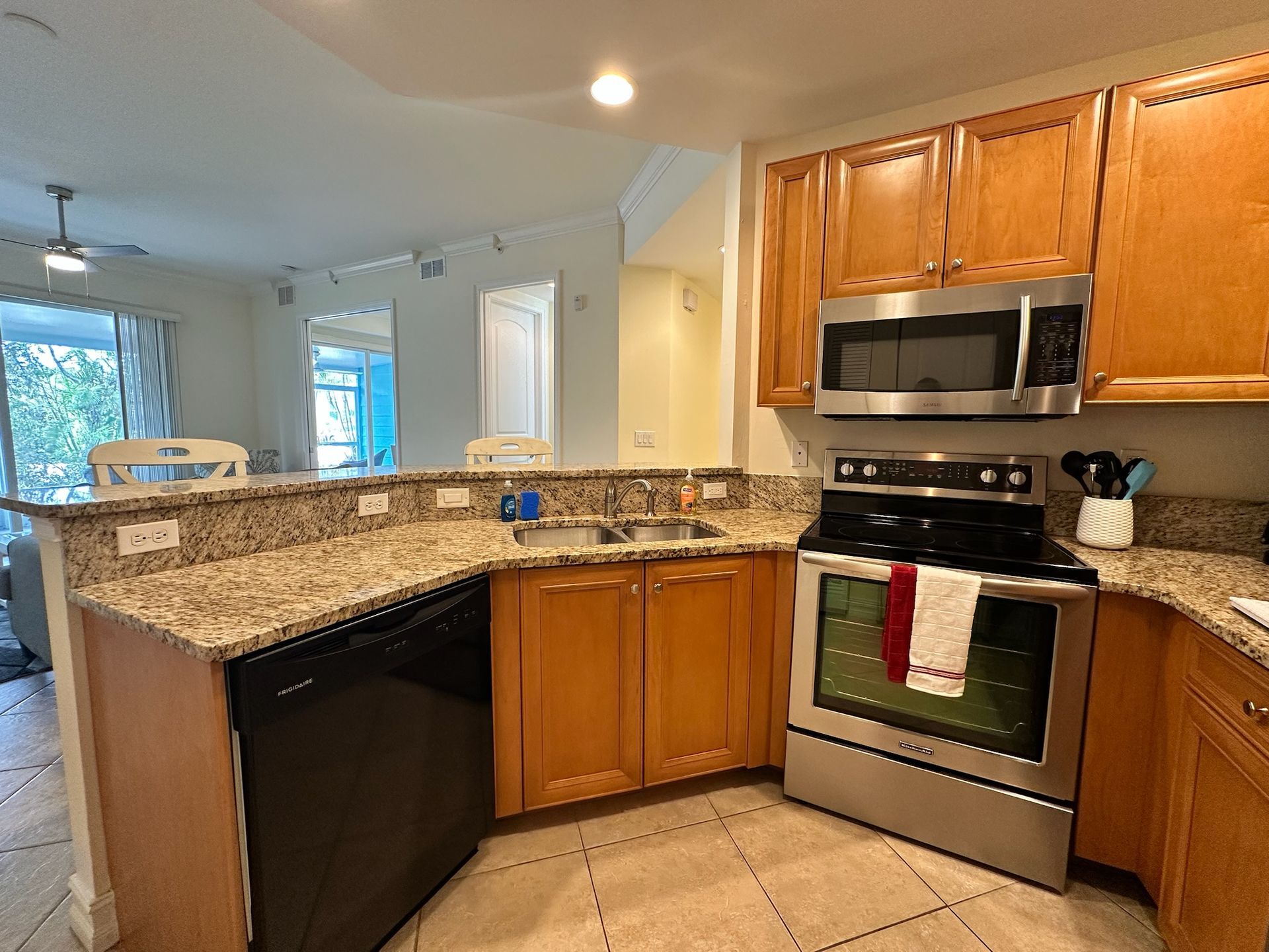 A kitchen with stainless steel appliances and granite counter tops