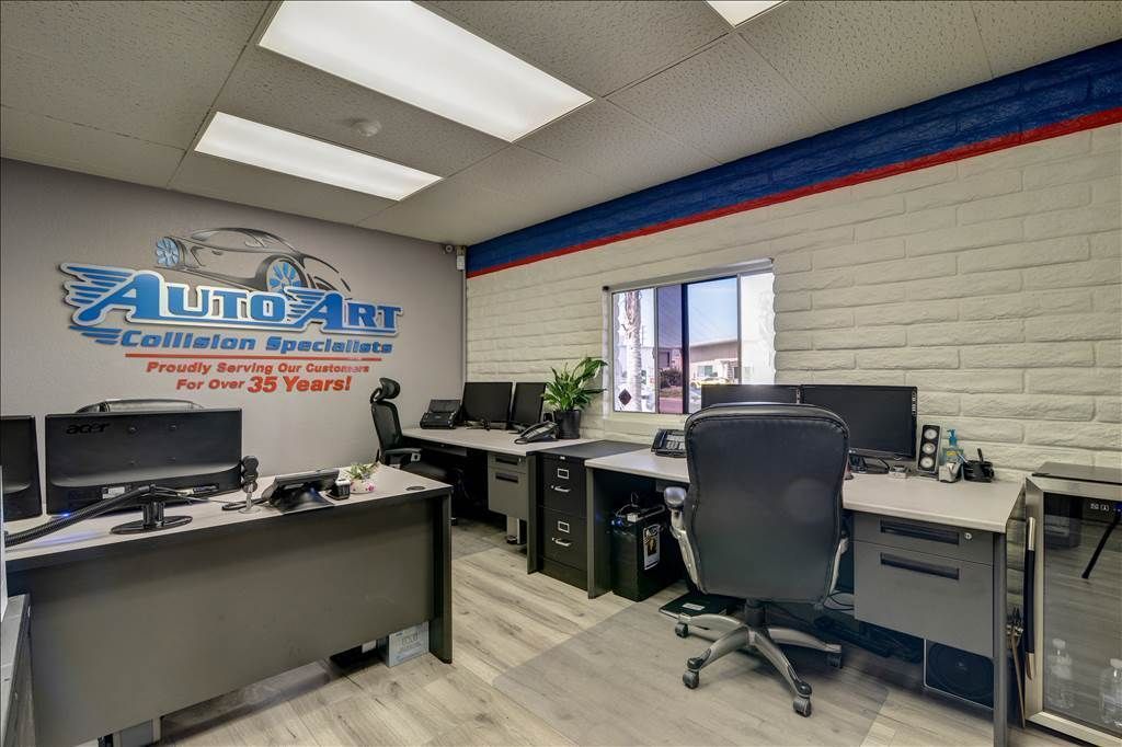 An office with a sign on the wall that says auto air