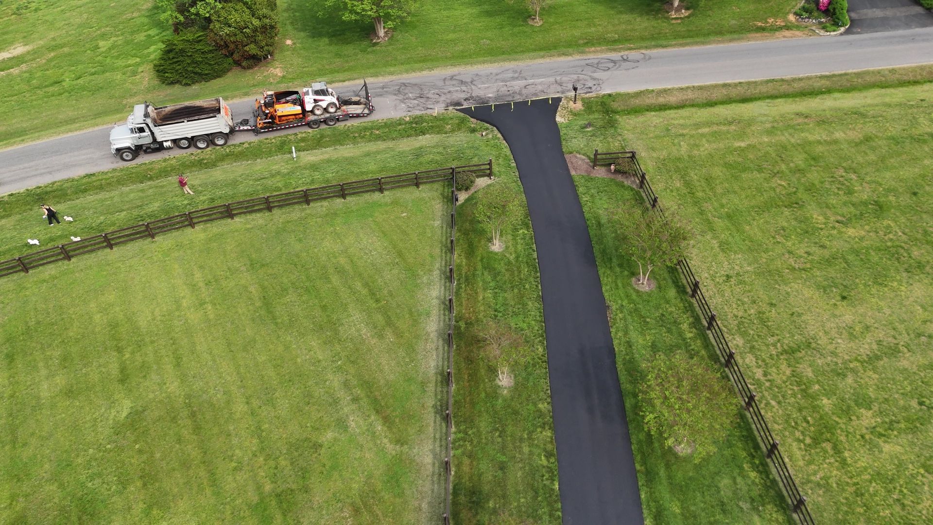 No driveway to long or short for us. We repaired the bad areas and resurfaced this driveway to give it a fresh look. 