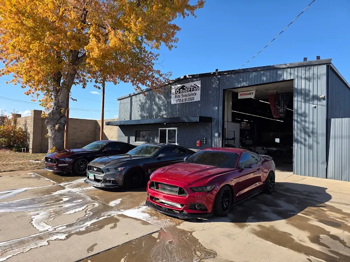 Three Ford Mustangs in Red, Gray, and Black Parked in Front of  The Shop | CRF Automotive Specialists