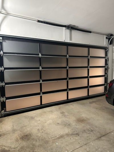 Garage door with frosted panels in a concrete garage.