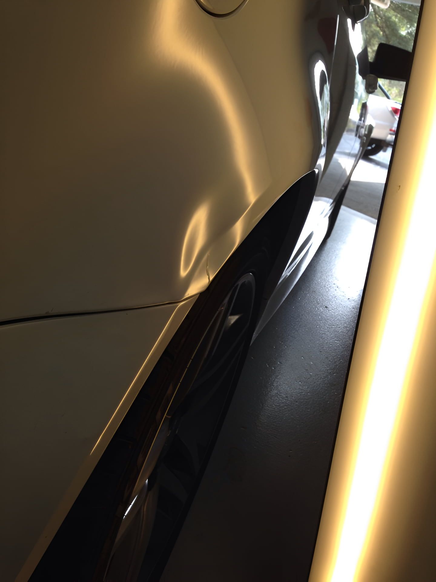 A Close Up Of A Car With A Dent On The Side — Rapid Auto Dent In Tuggerah, NSW