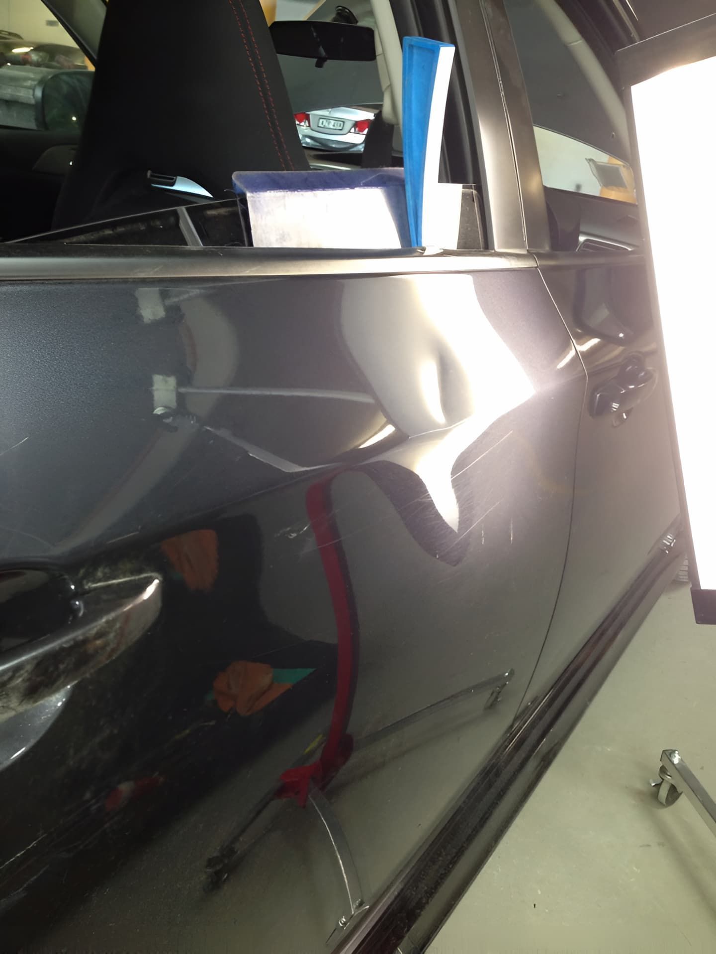 A Close Up of a Car Door With a Light on It — Rapid Auto Dent In Terrigal, NSW