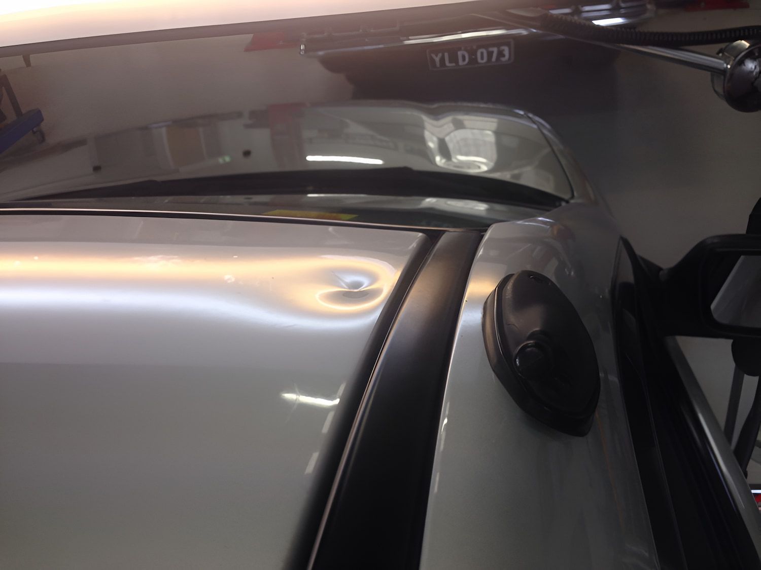A Silver Car Being Repaired — Rapid Auto Dent In Terrigal, NSW