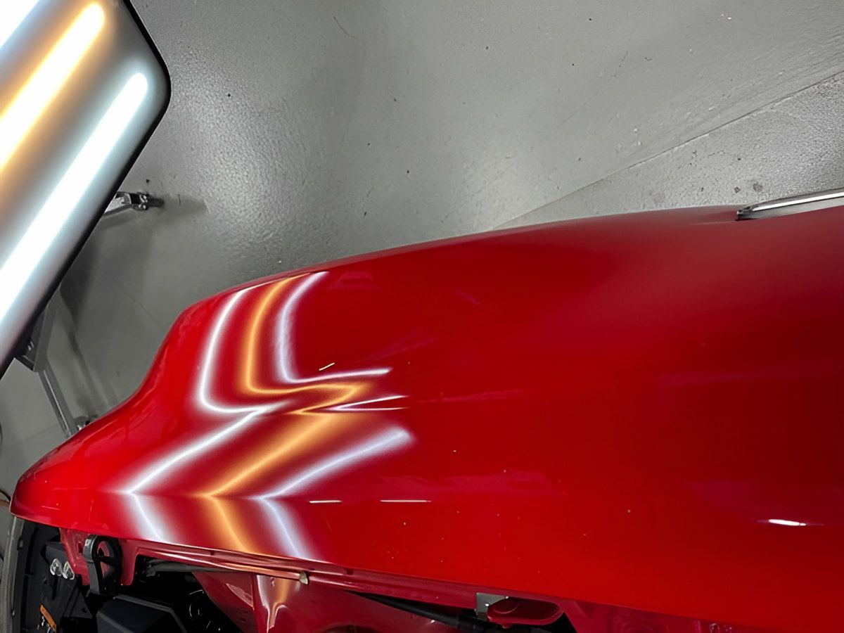 A Car With A Dent In The Roof Is Sitting In A Garage — Rapid Auto Dent In West Gosford, NSW