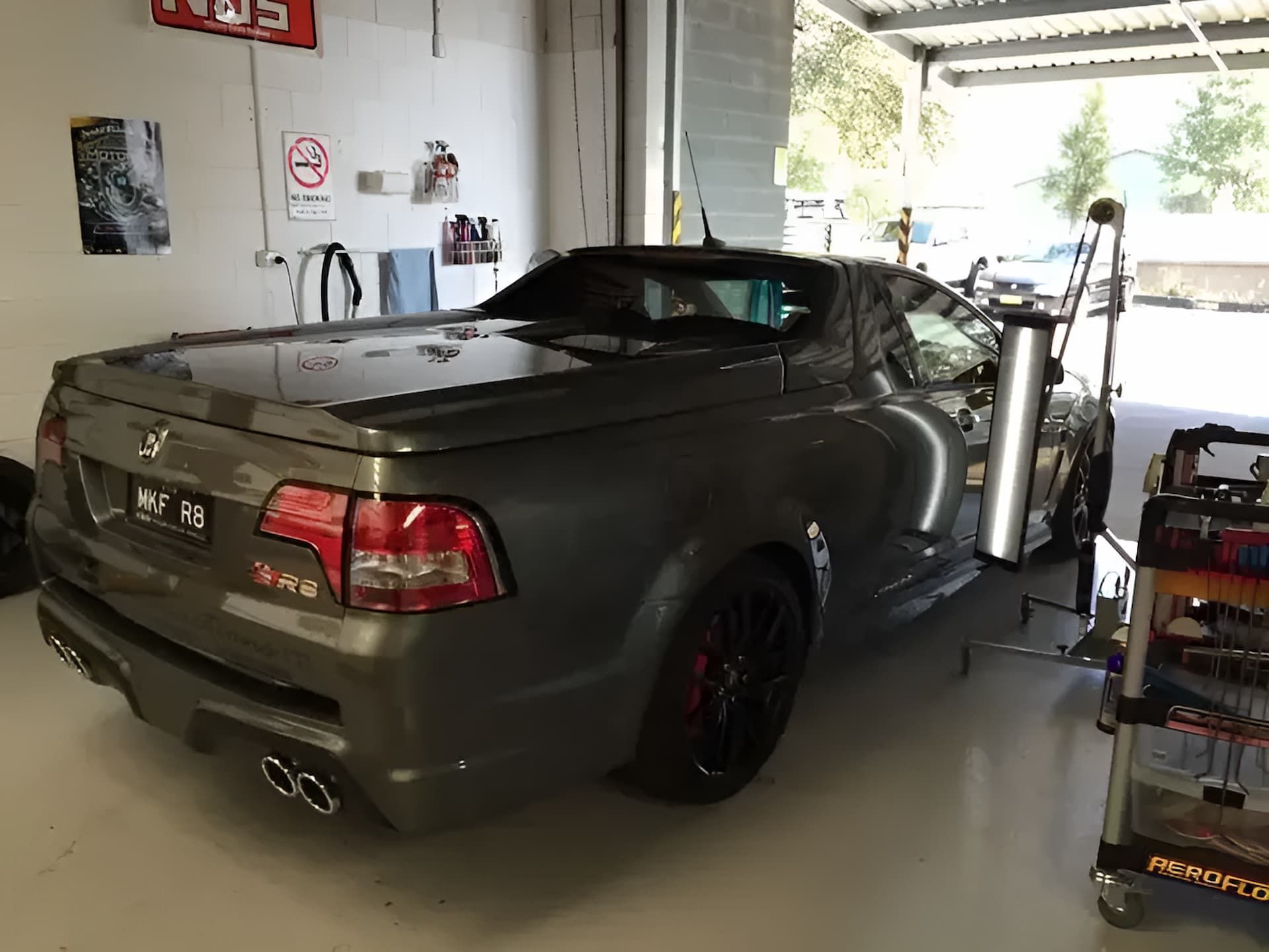 A Gray Pickup Truck is Parked in a Garage — Rapid Auto Dent In Budgewoi, NSW