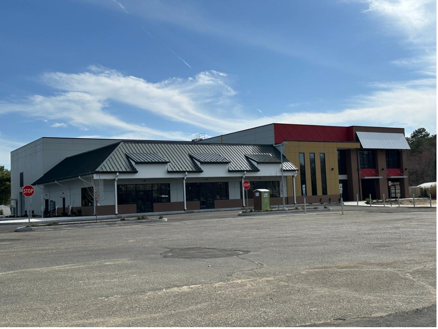 A large building with a stop sign in front of it