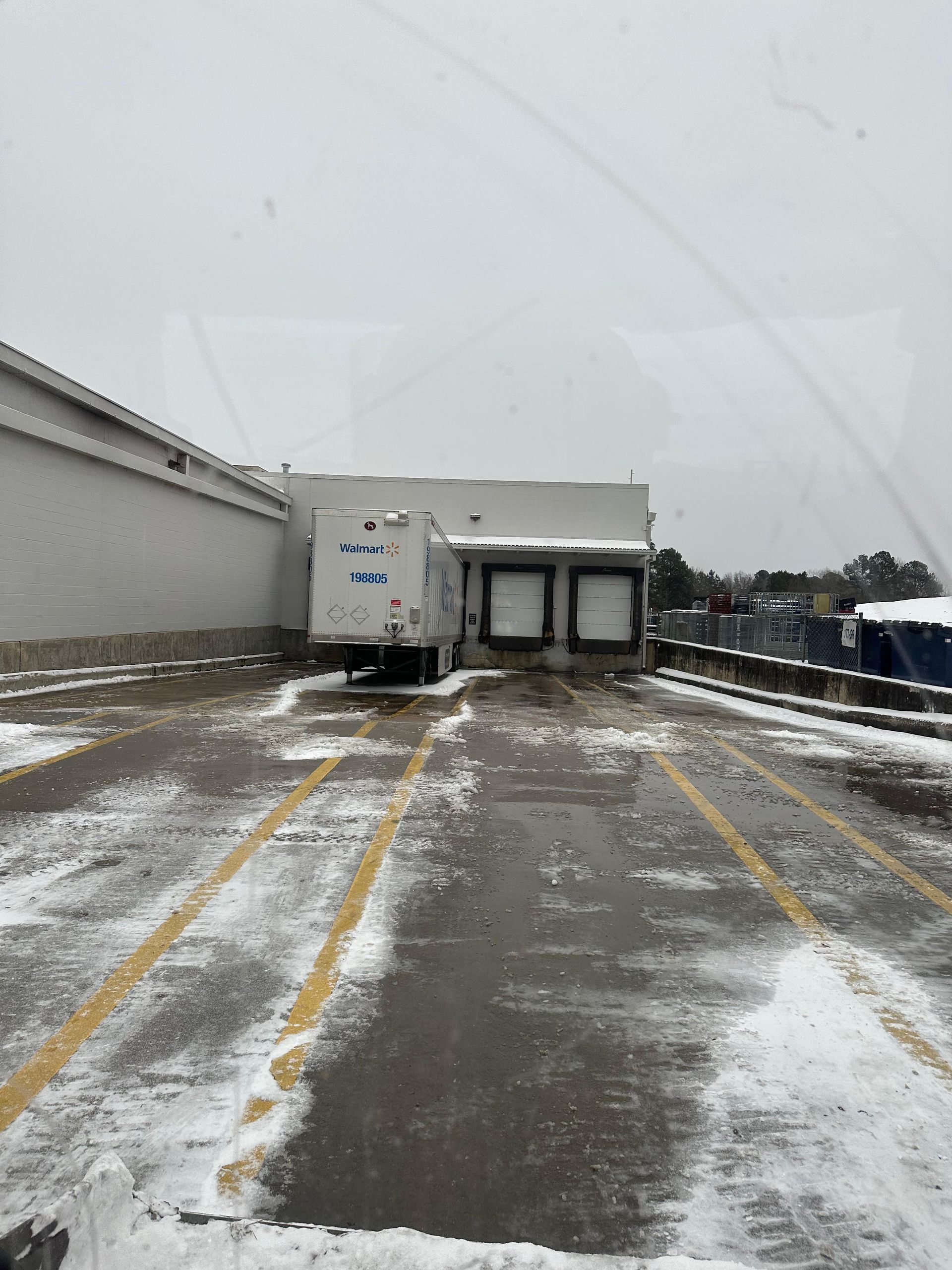 A Walmart semi docking station cleared of snow.