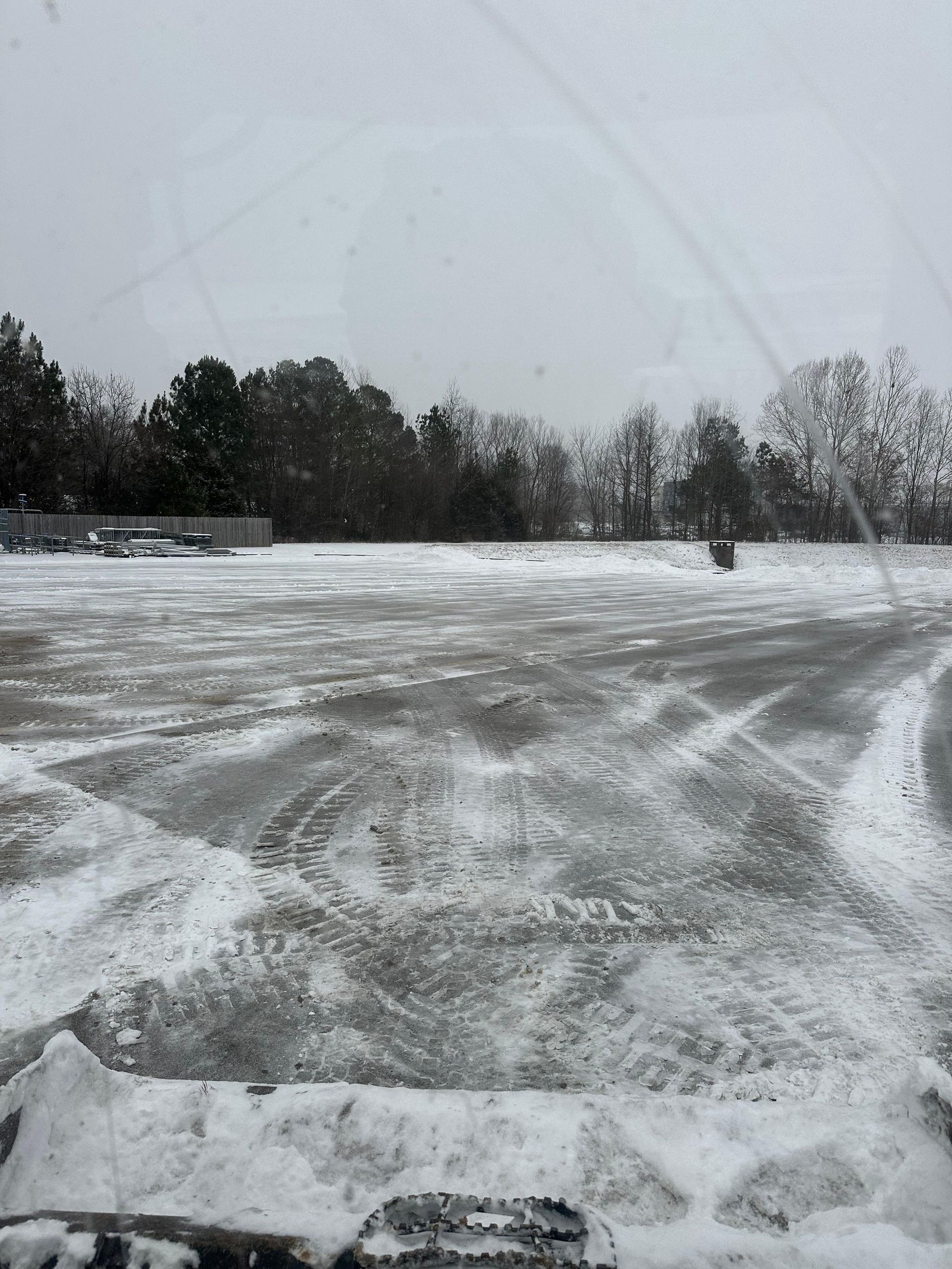 A parking lot post snow removal and salting services.