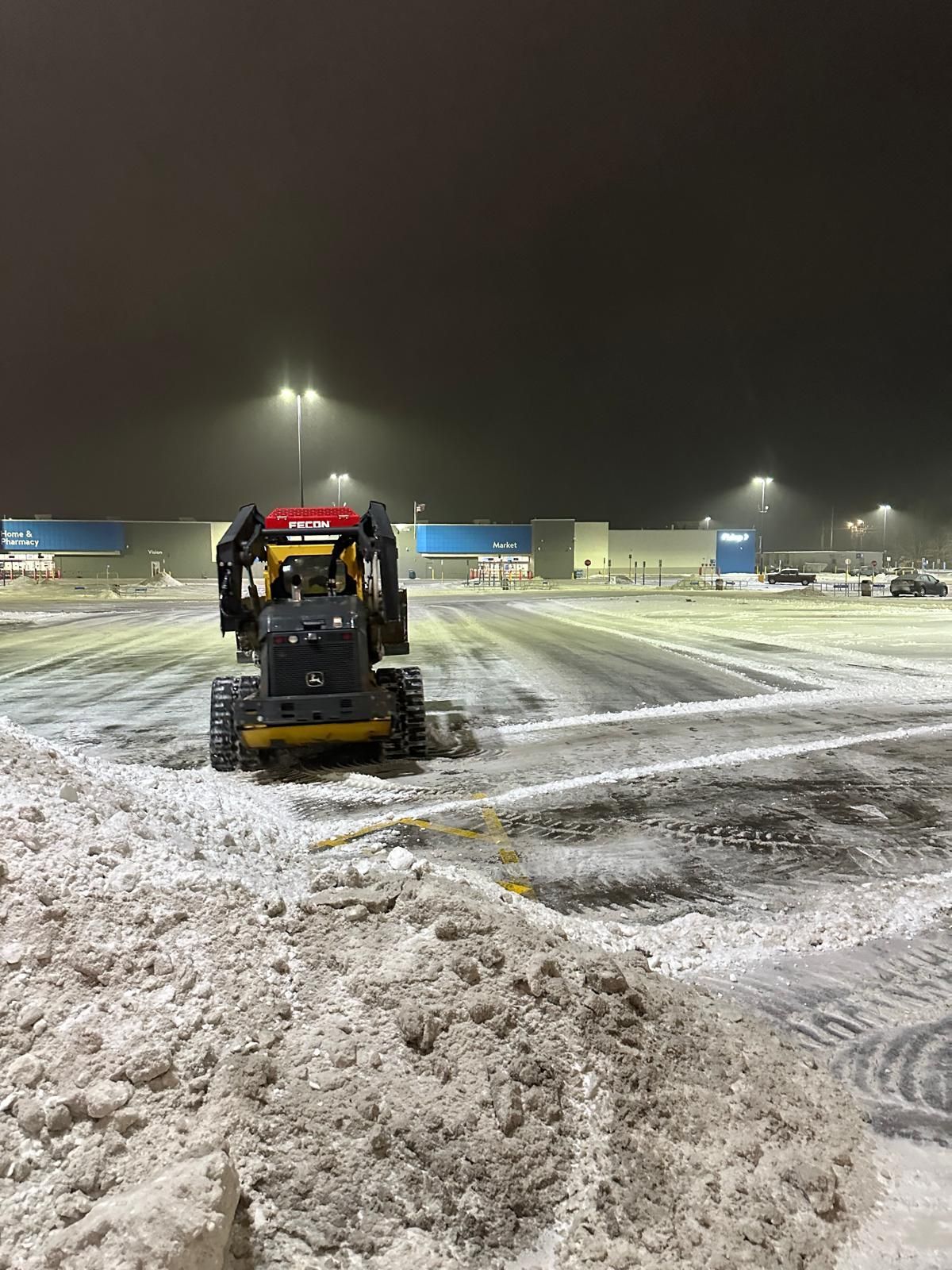 A Walmart parking lot post snow removal and salting services.