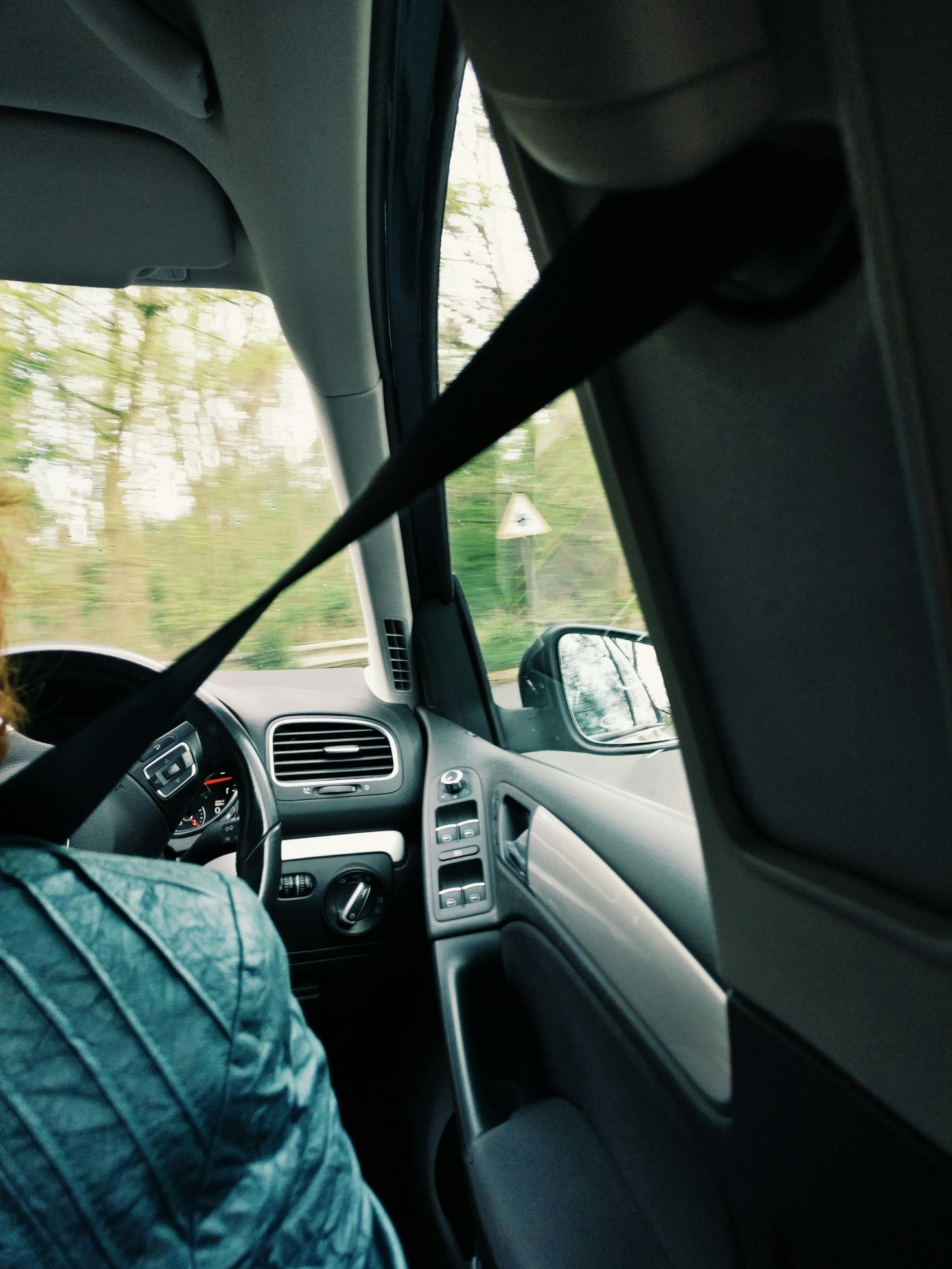 A person is driving a car with a seat belt on — Windscreen Ambulance In Kawana, QLD