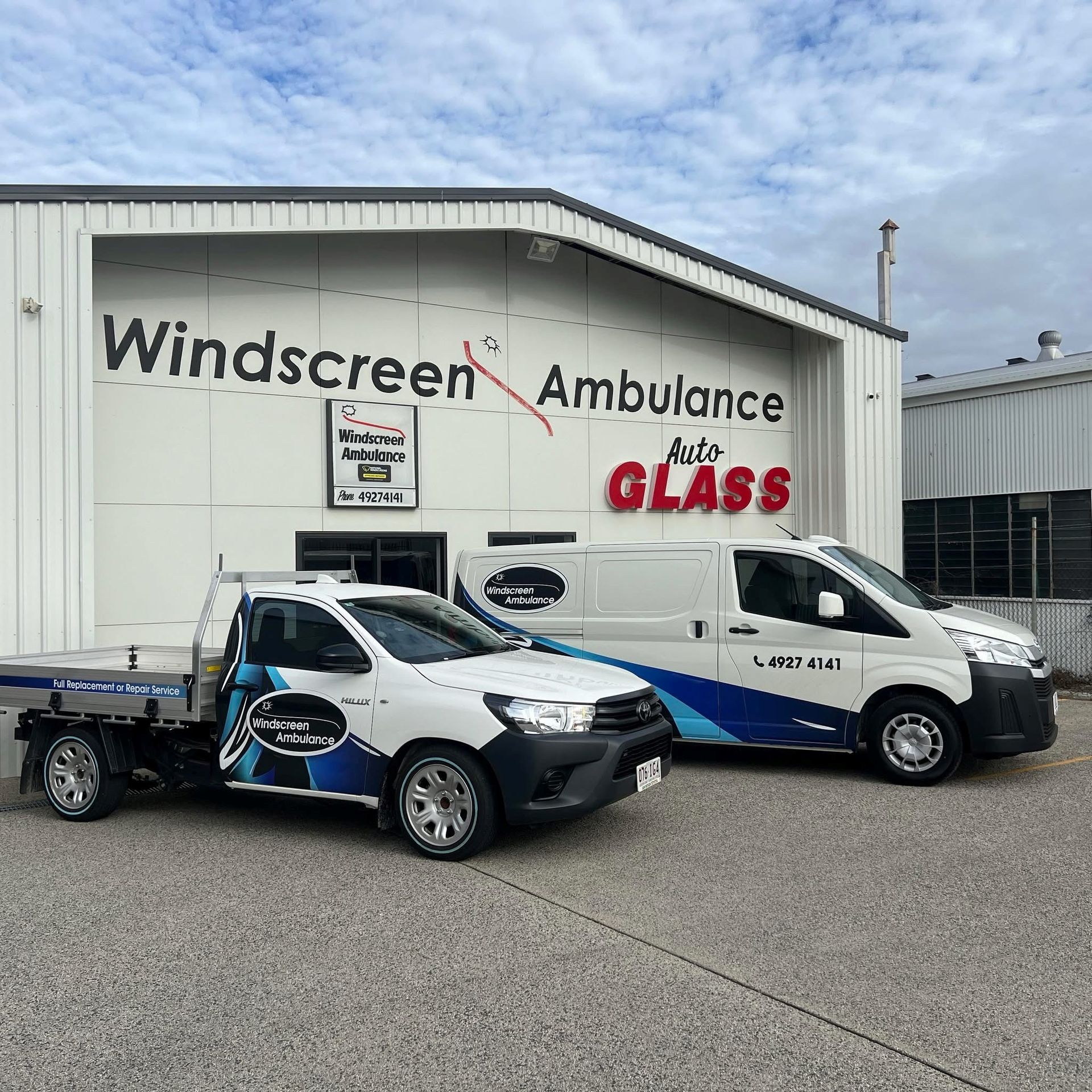 A White Truck Is Parked In Front Of A Building That Says Windscreen Ambulance Auto Glass — Windscreen Ambulance In Kawana, QLD